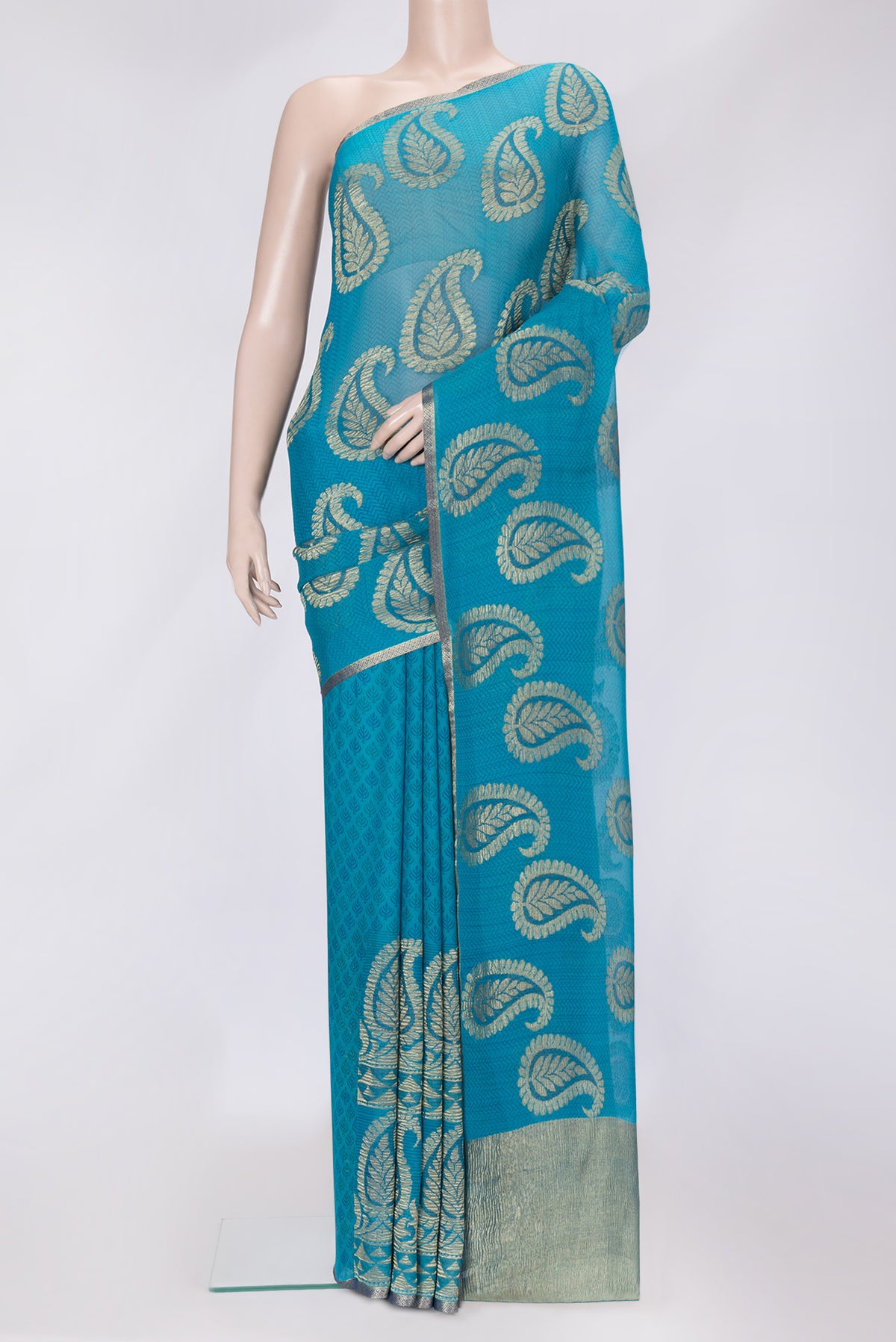 Sky Blue Dual Tone Mysore Georgette Saree with Zari Butta on the body and Zari Border.  displayed on a mannequin