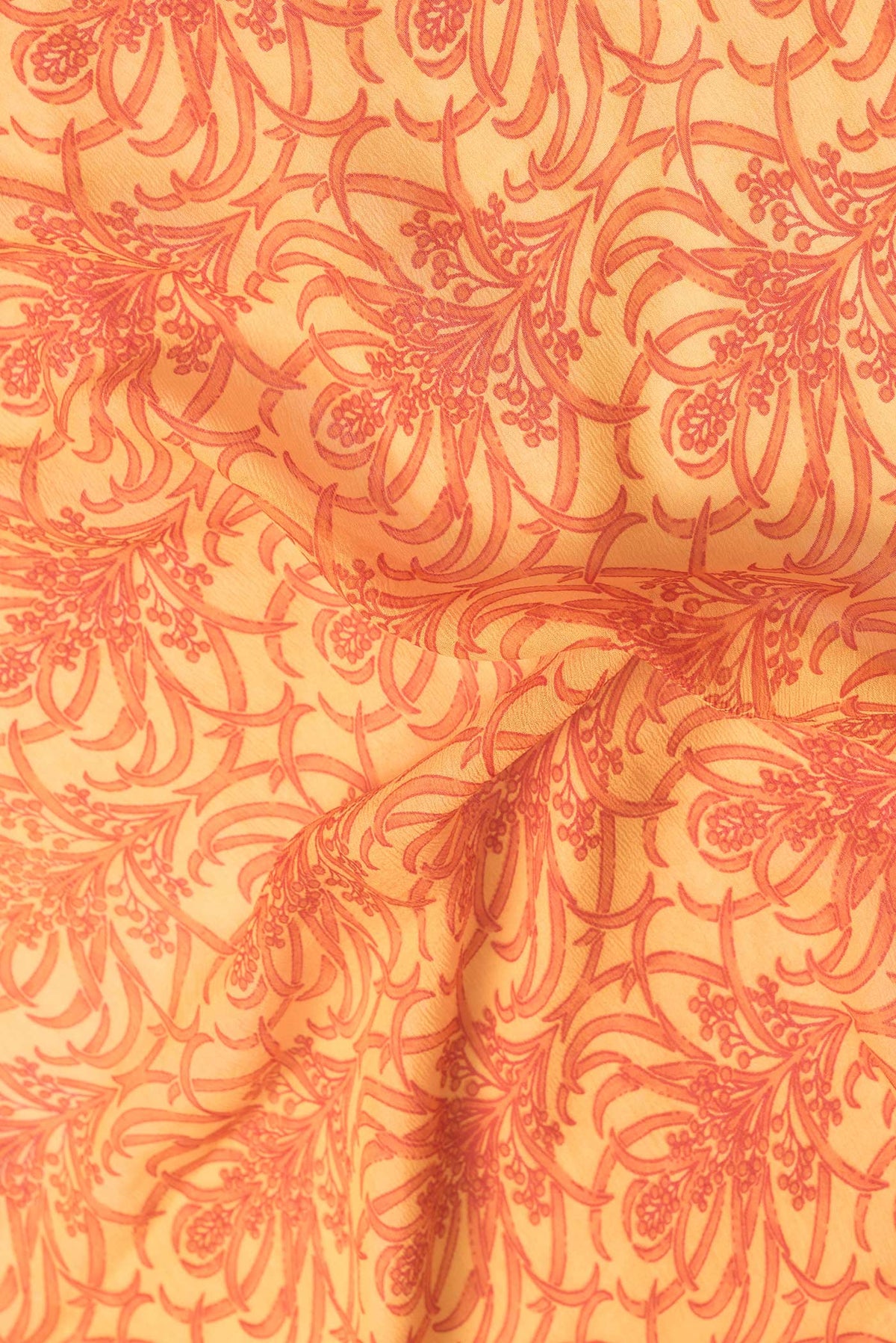 Close up of Yellow Dual Tone Mysore Georgette Saree with Printed design on the body and Zari Border.  displaying folds