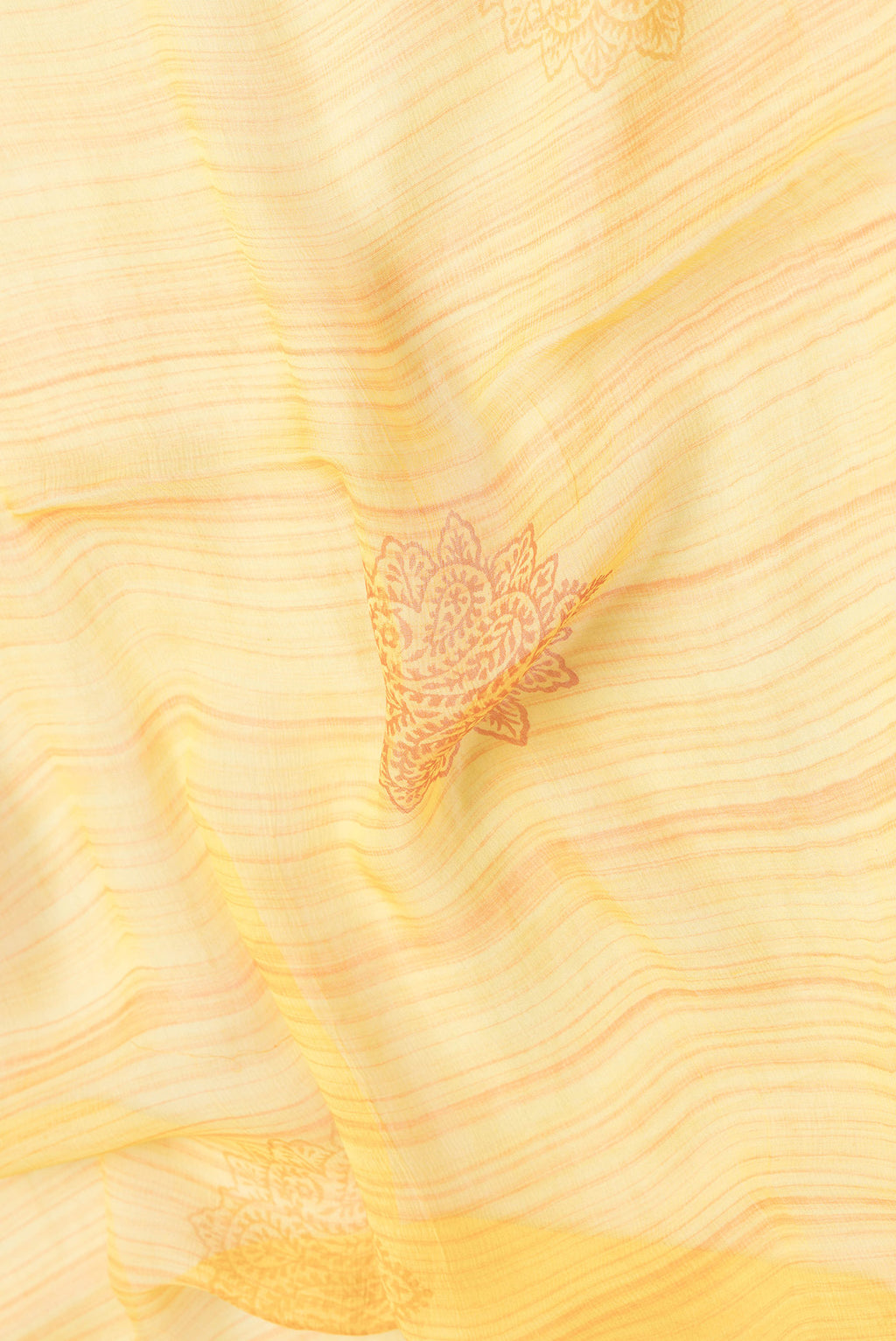 Close up of Yellow Dual Tone Mysore Chiffon Saree with Printed design on the body and Fancy Border.  displaying folds