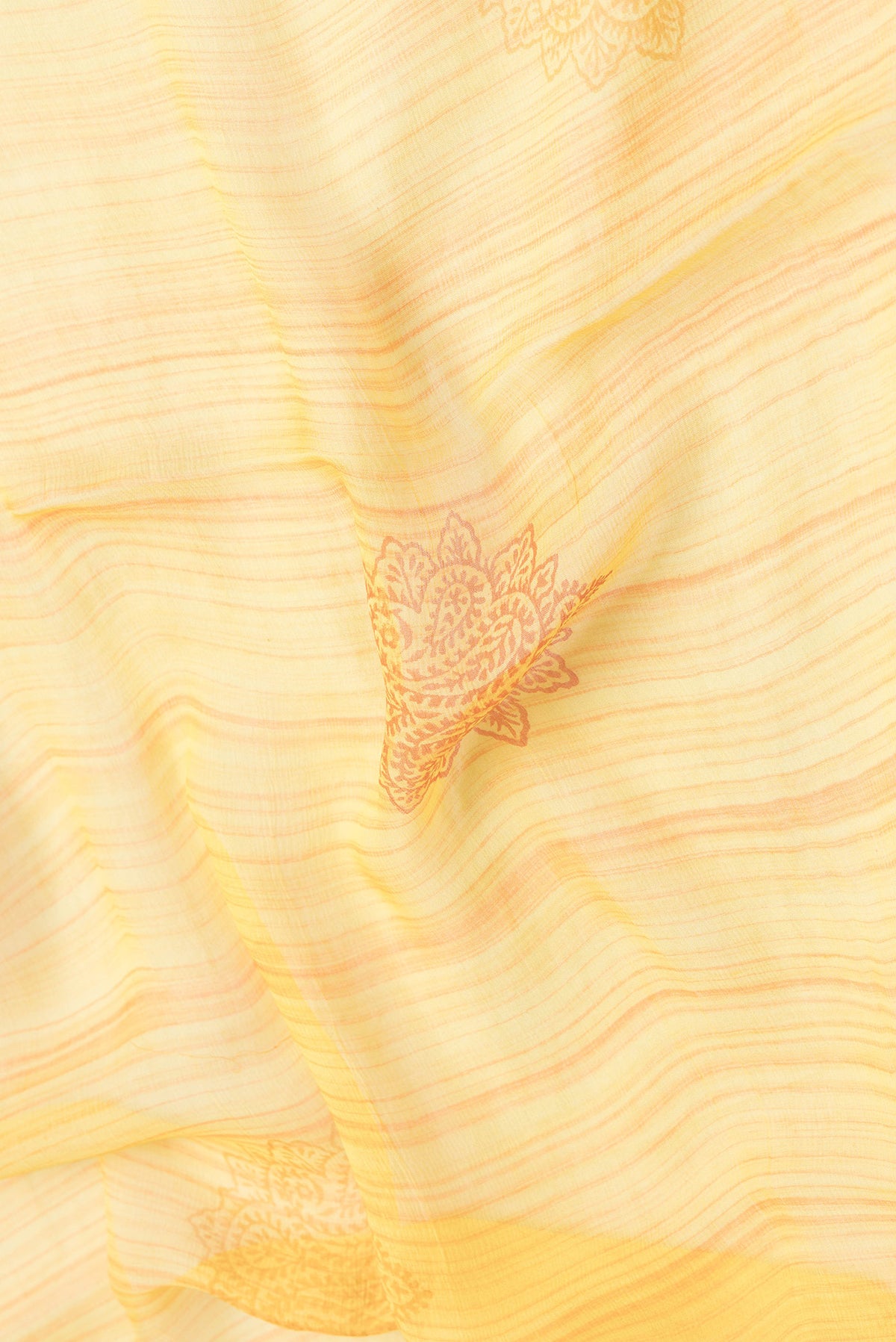 Close up of Yellow Dual Tone Mysore Chiffon Saree with Printed design on the body and Fancy Border.  displaying folds