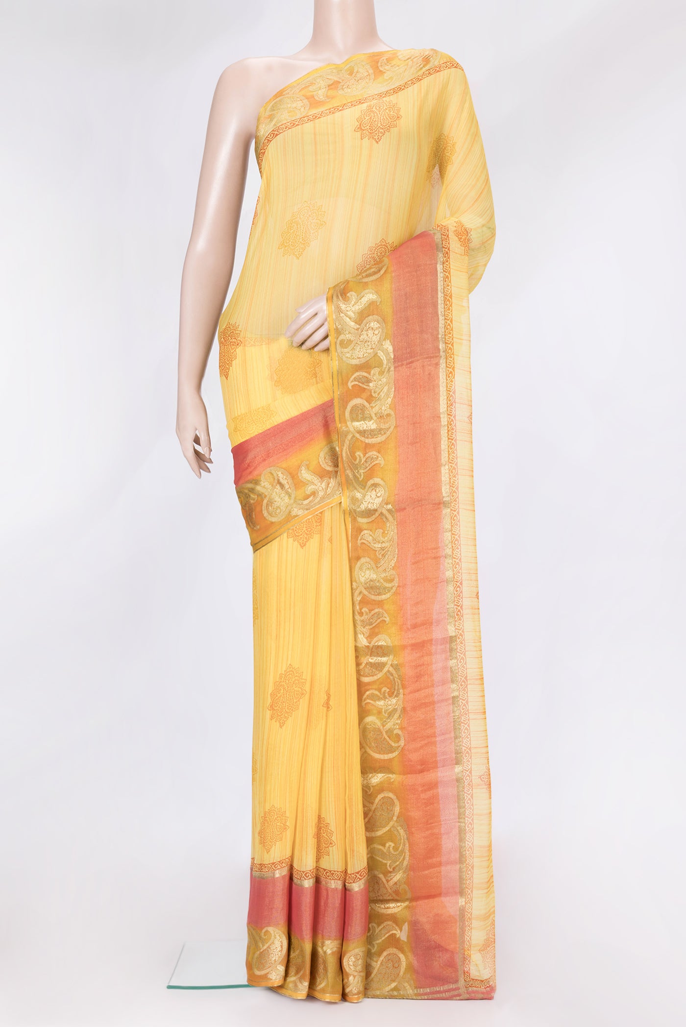 Yellow Dual Tone Mysore Chiffon Saree with Printed design on the body and Fancy Border.  displayed on a mannequin
