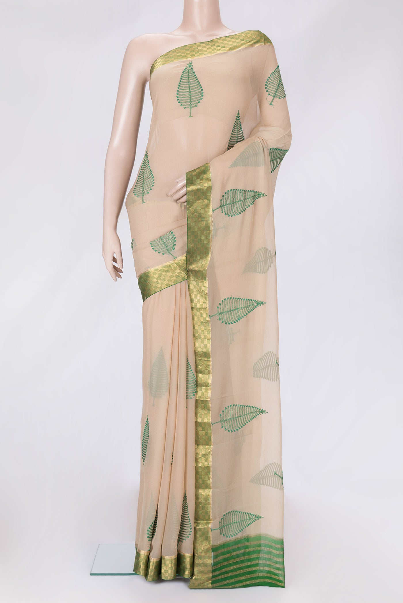 Beige Dual Tone Mysore Chiffon Saree with Embroidery on the body and Zari Border.  displayed on a mannequin