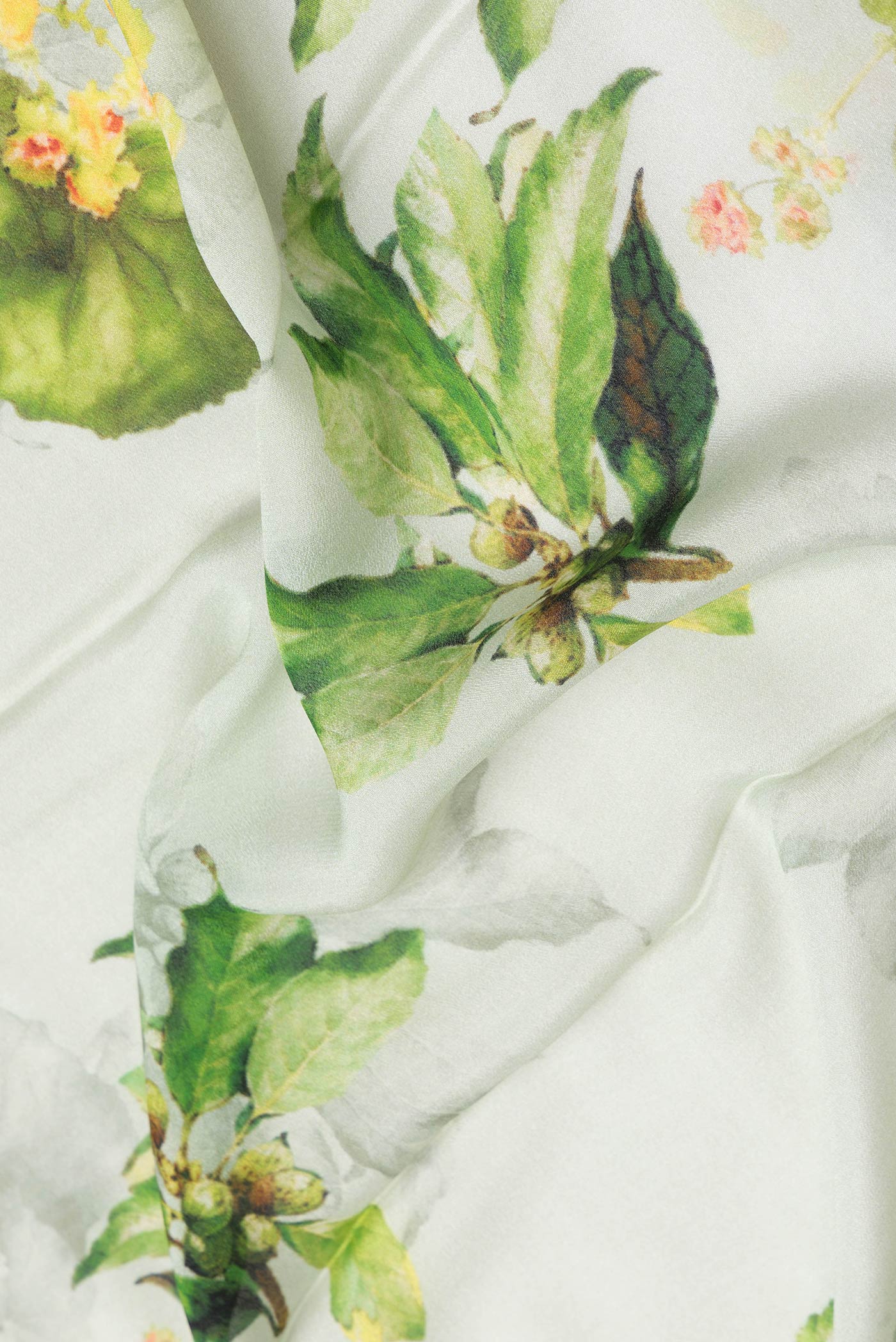 Close up of Pista Green Dual Tone Mysore Crepe Saree with Printed design on the body and Zari Border.  displaying folds