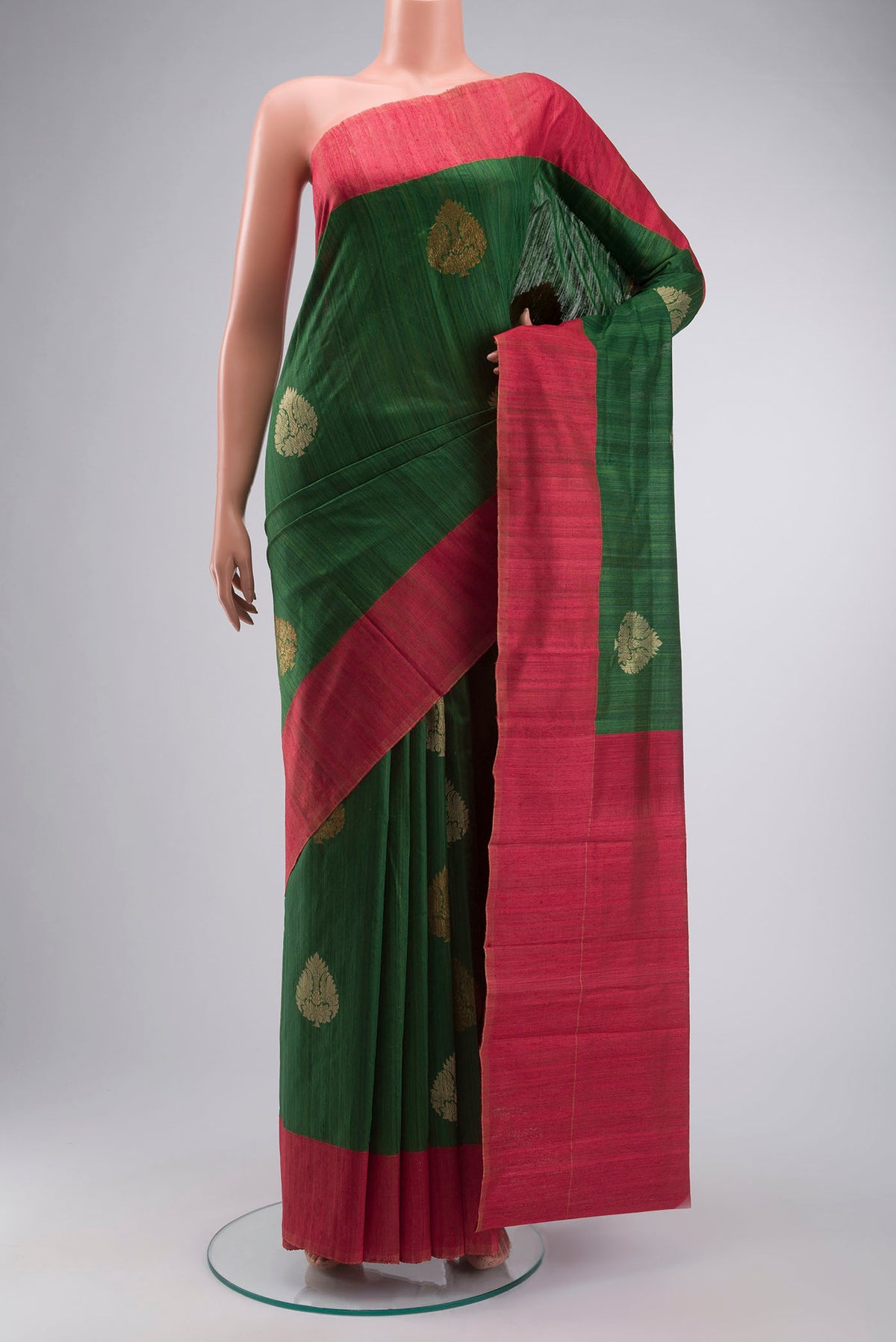 Green Bhagalpuri Tussar Silk Saree with Zari Butta on the body and Plain Border displayed on a mannequin