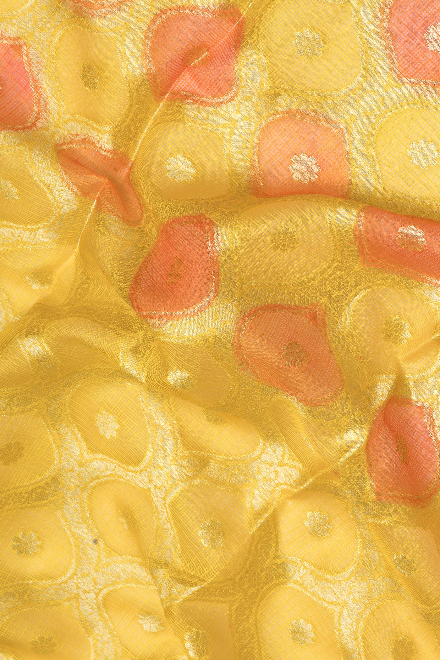 Close up of Yellow Kota Silk Saree with Zari Brocade on the body and Ganga Jamuna Border.  displaying folds
