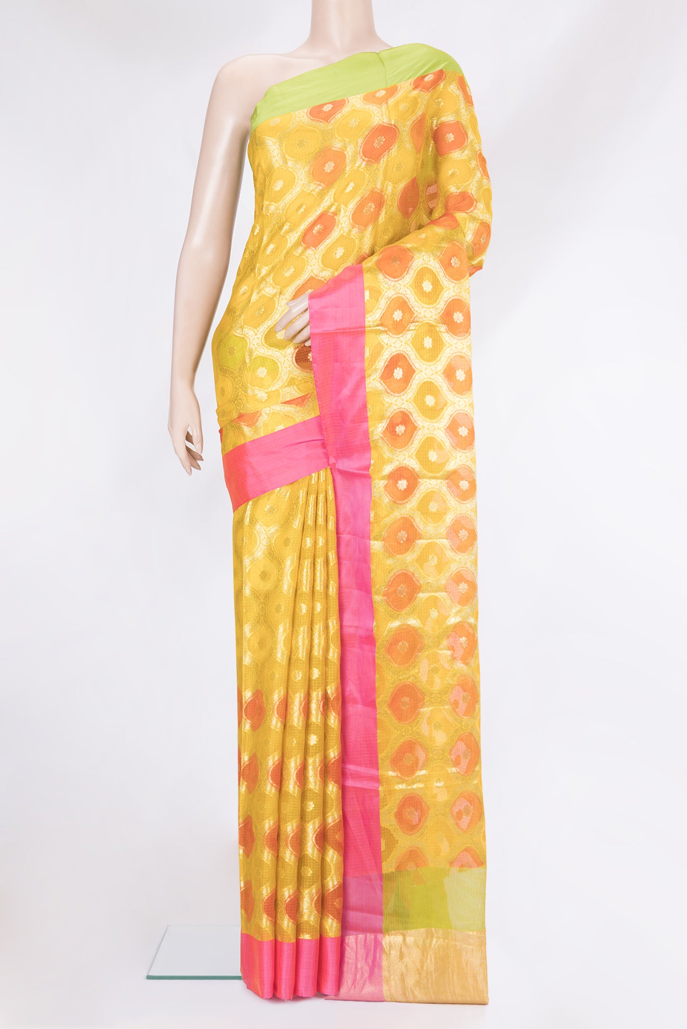 Yellow Kota Silk Saree with Zari Brocade on the body and Ganga Jamuna Border.  displayed on a mannequin