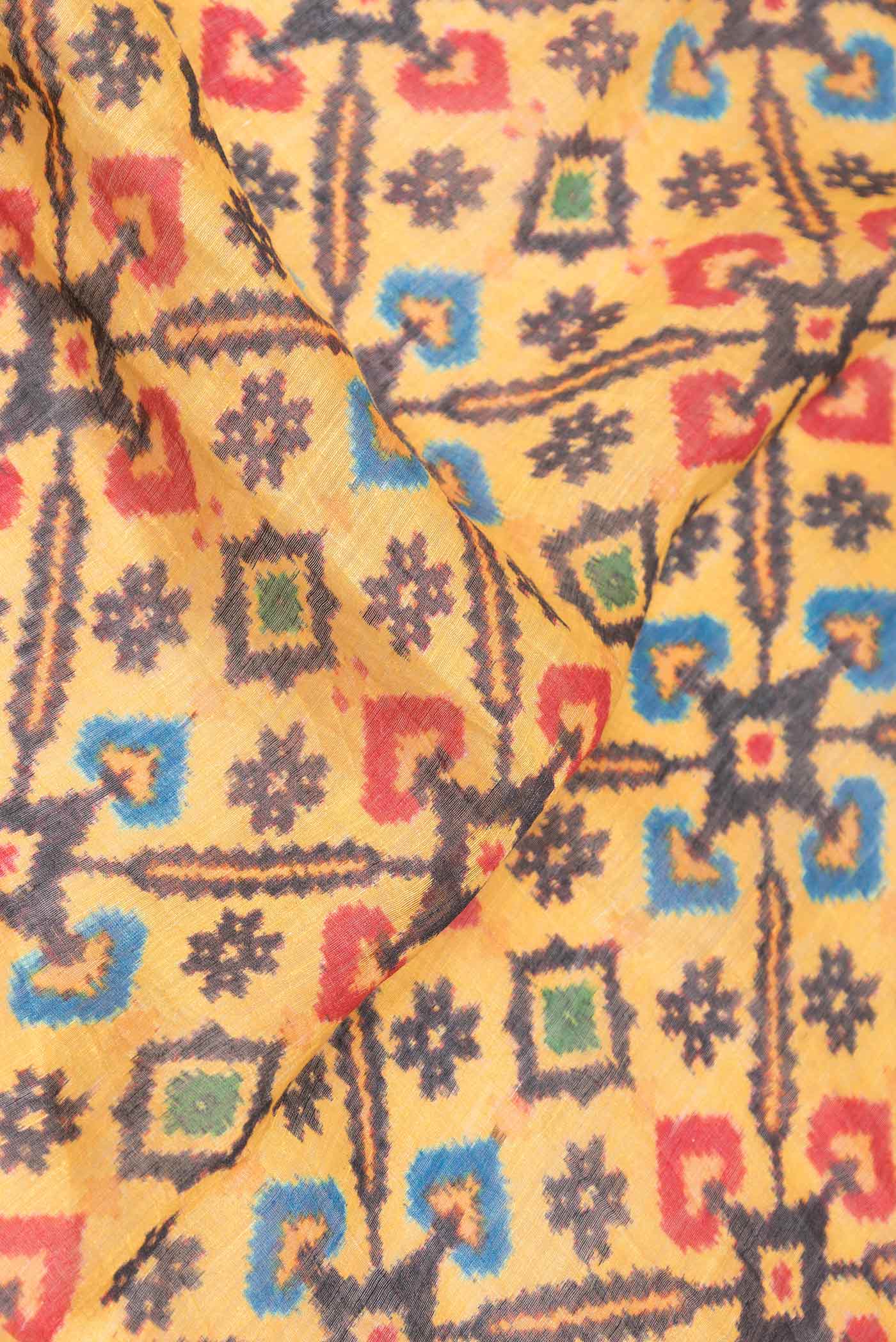 Close up of Yellow Dual Tone Linen Saree with Printed design on the body and Zari Border displaying folds