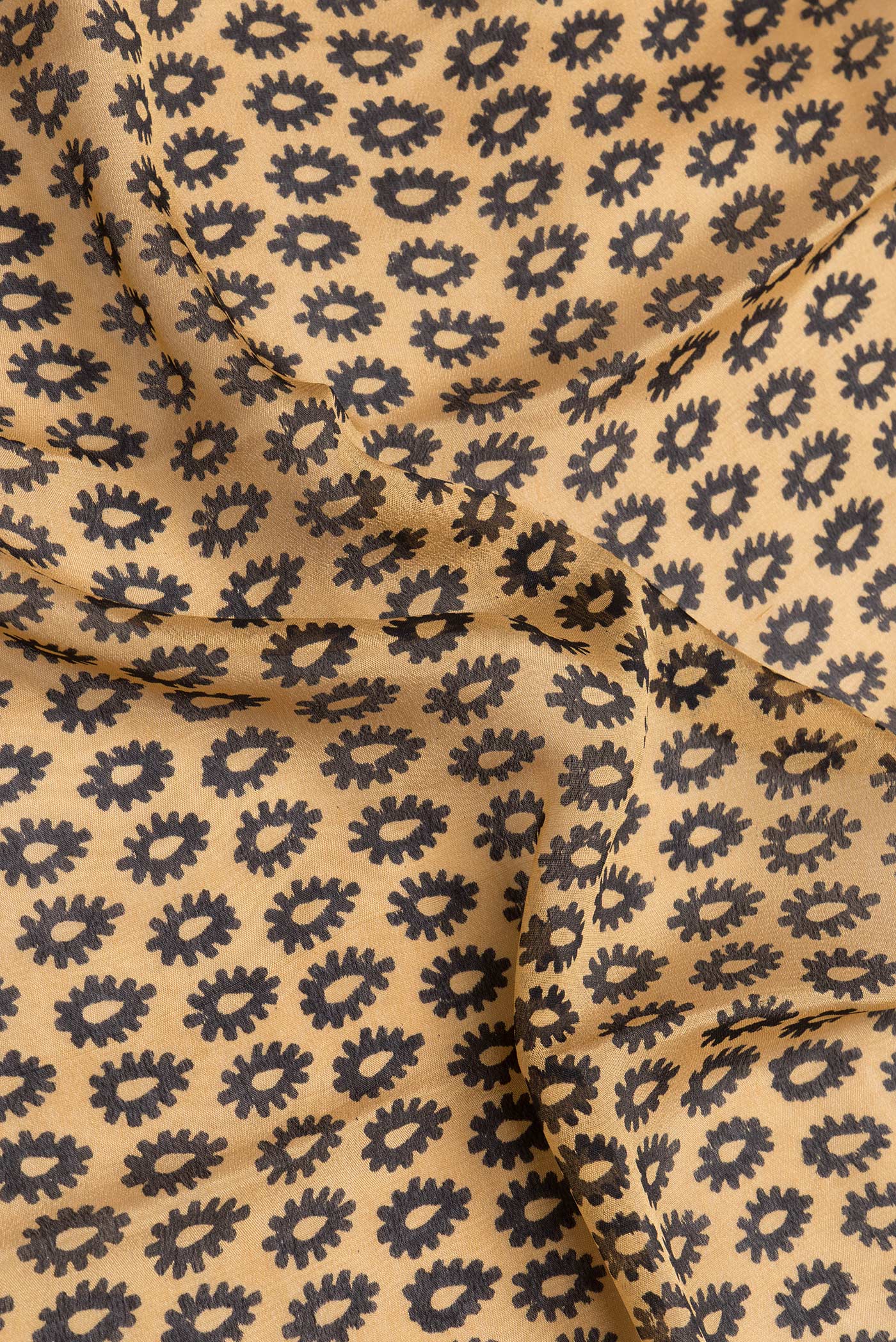 Close up of Sandal Dual Tone Crepe Saree with Printed design on the body and Printed Border.  displaying folds