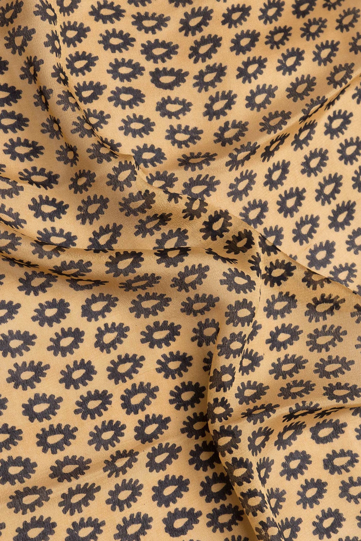 Close up of Sandal Dual Tone Crepe Saree with Printed design on the body and Printed Border.  displaying folds