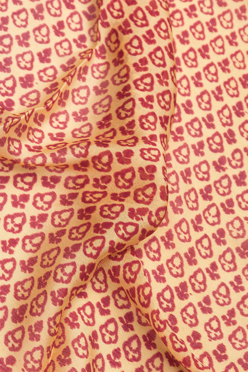 Close up of Sandal Dual Tone Mysore Crepe Saree with Printed design on the body and Printed Border.  displaying folds