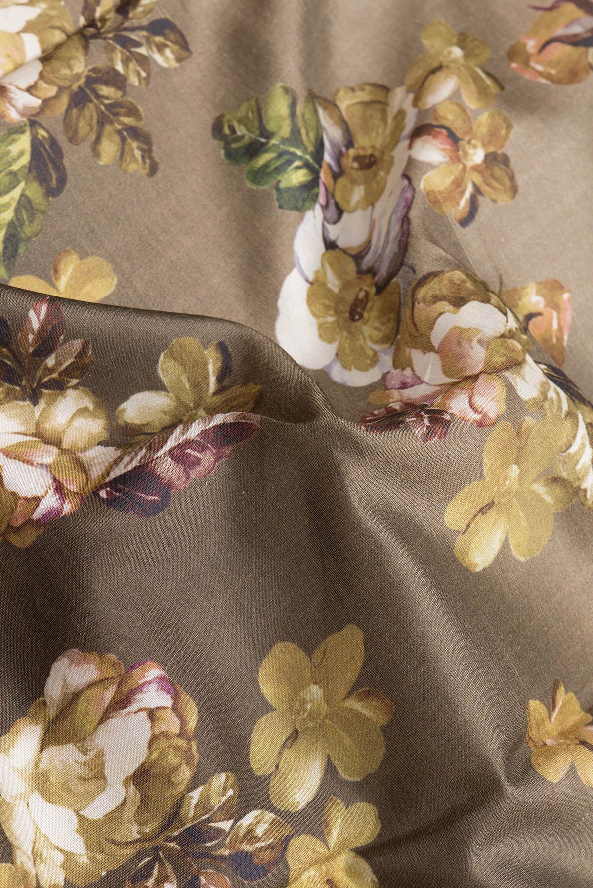 Close up of Mehandi Green Dual Tone Tussar Silk Saree with Printed design on the body and Zari Border.  displaying folds