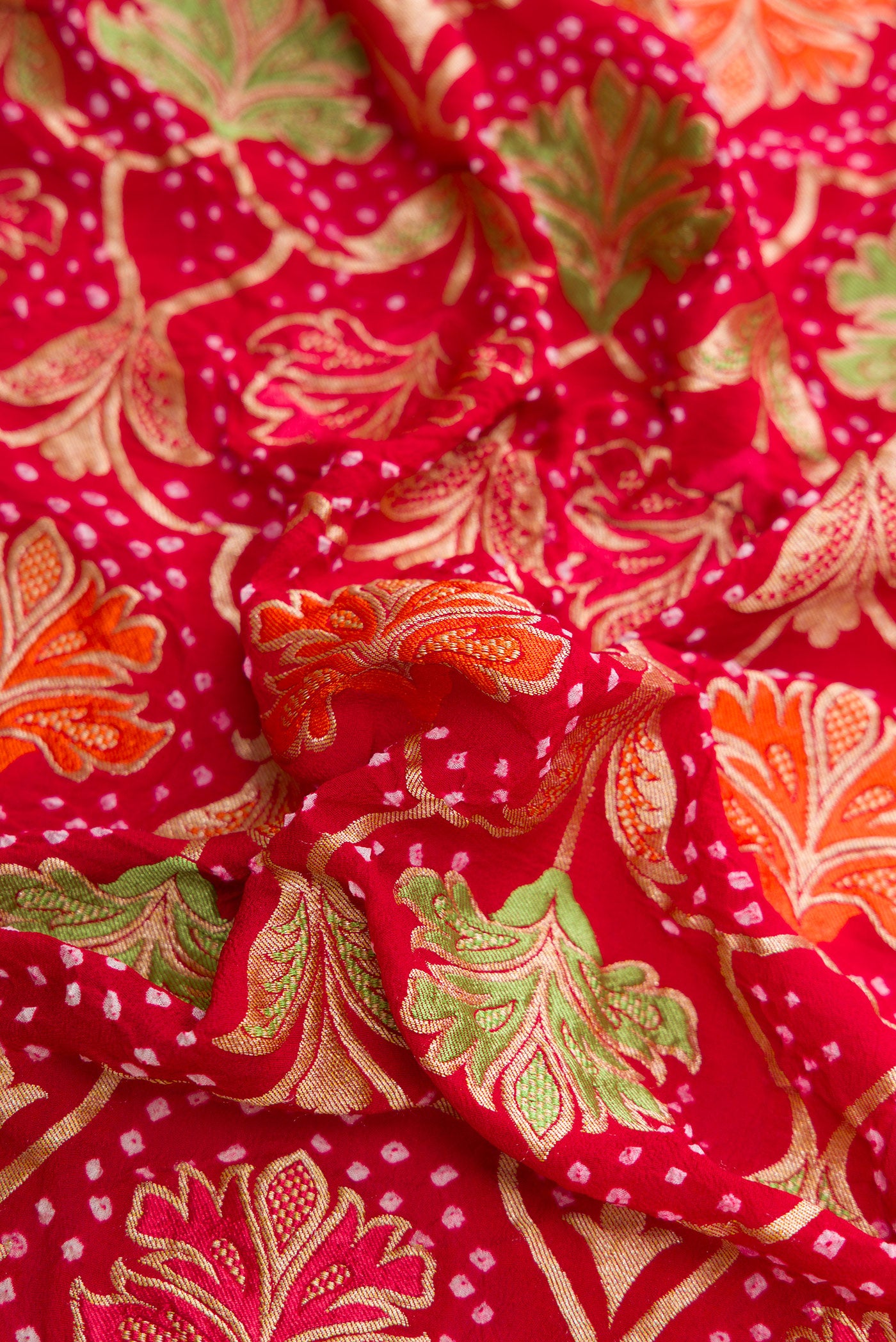 Close up of Red Dual Tone Banarasi Georgette Saree with Zari Brocade on the body and Zari Border.  displaying folds