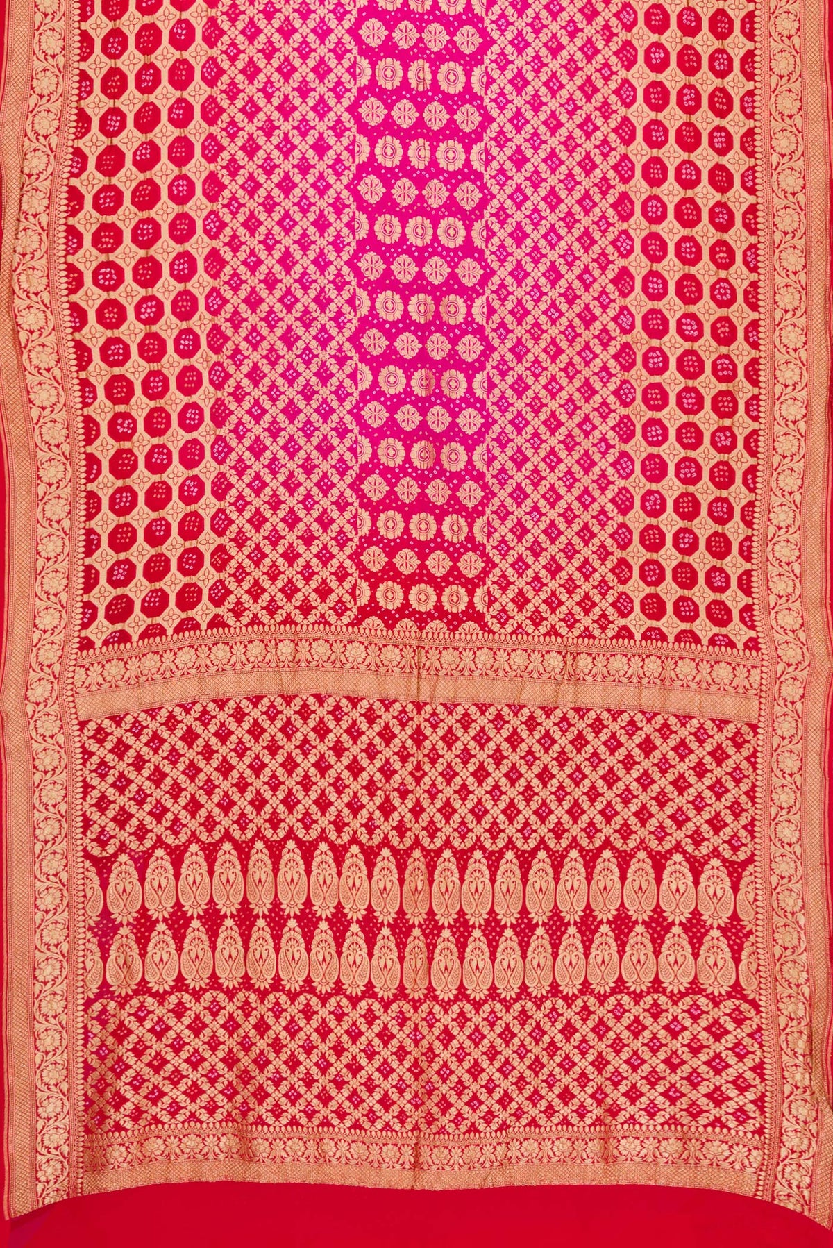 Flat view of Pink and Red Color Bandhani Silk Saree with Bandhani Print on the body and Zari Border. 