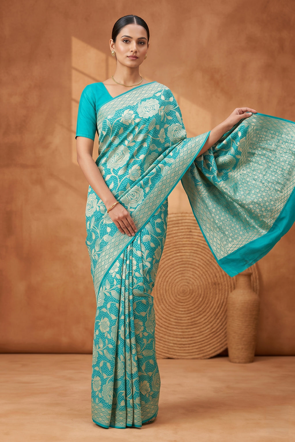 Model wearing a Sky Blue Banarasi Georgette Saree with Bandhani Print on the body and Zari Border.