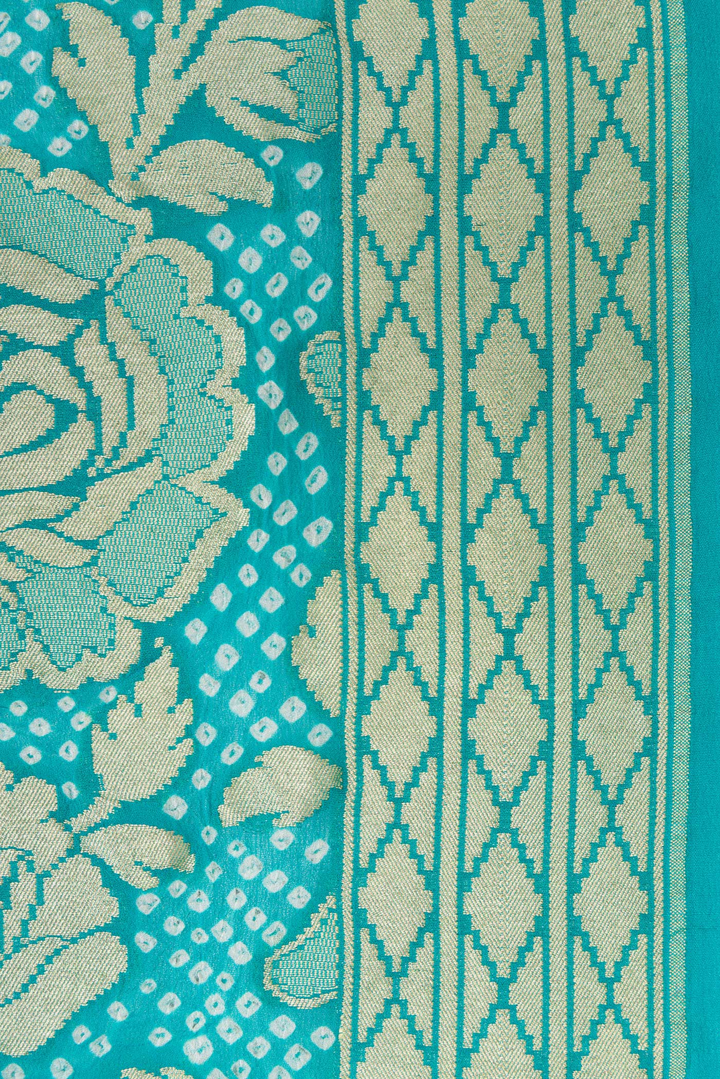 Border image of Sky Blue Dual Tone Bandhani Silk Saree with Bandhani Print on the body and Zari Border. 