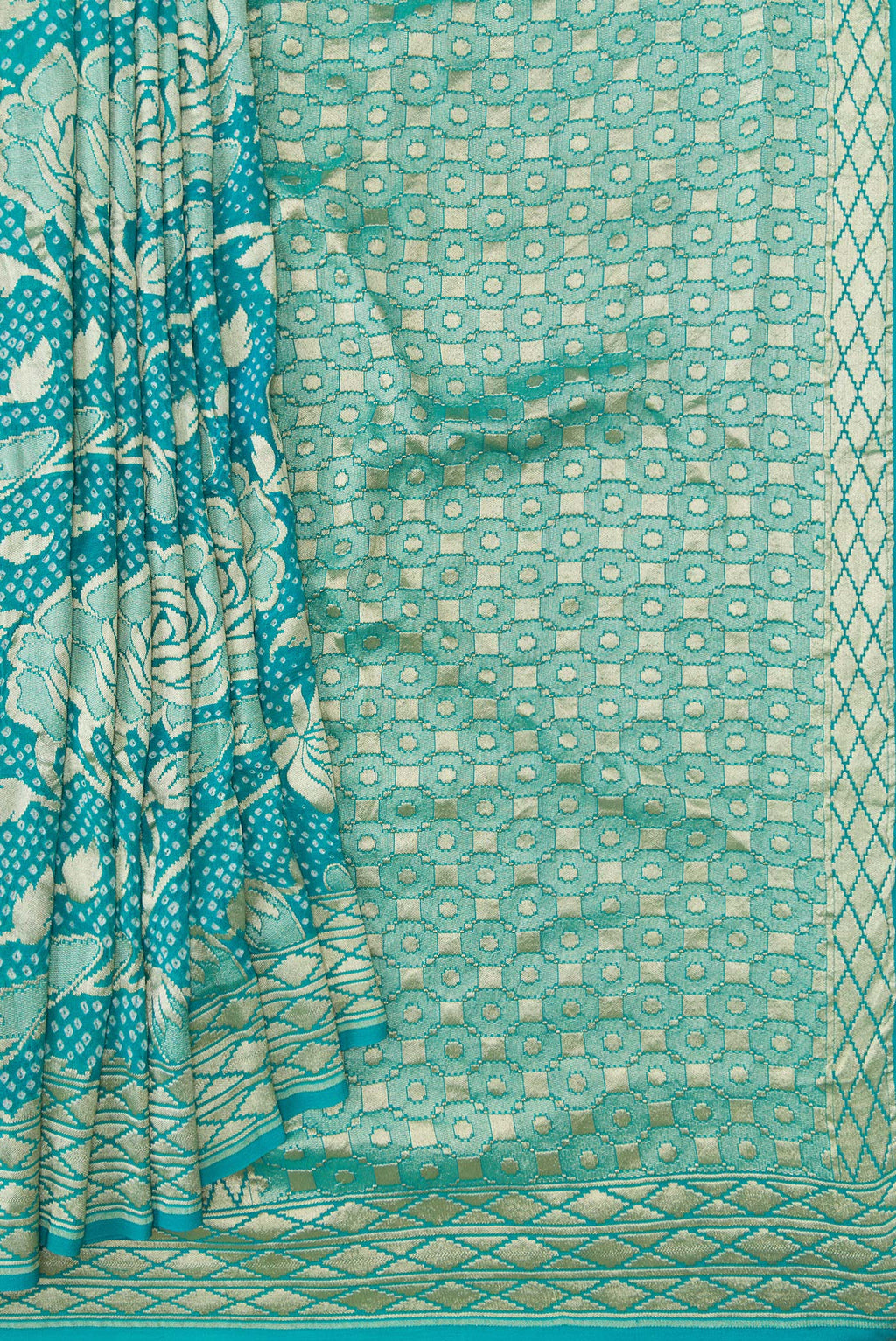 Pleats and pallu of Sky Blue Dual Tone Bandhani Silk Saree with Bandhani Print on the body and Zari Border. 