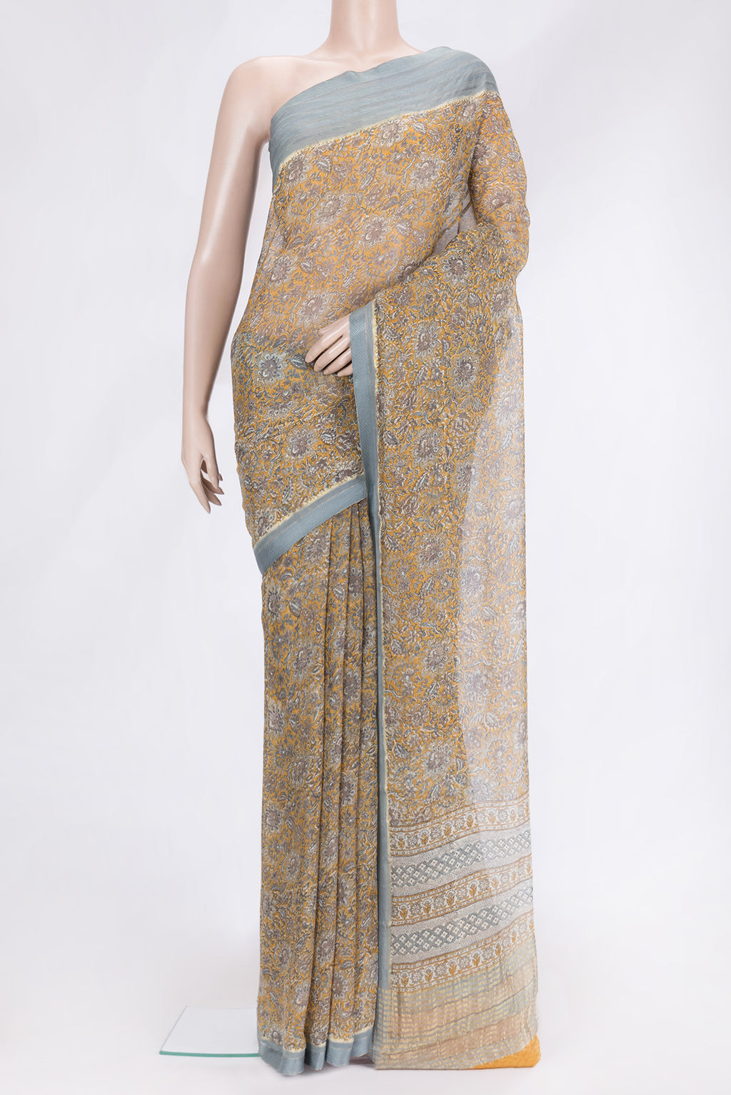 Mustard Dual Tone Mysore Chiffon Saree with Printed design on the body and Zari And Thread Border.  displayed on a mannequin