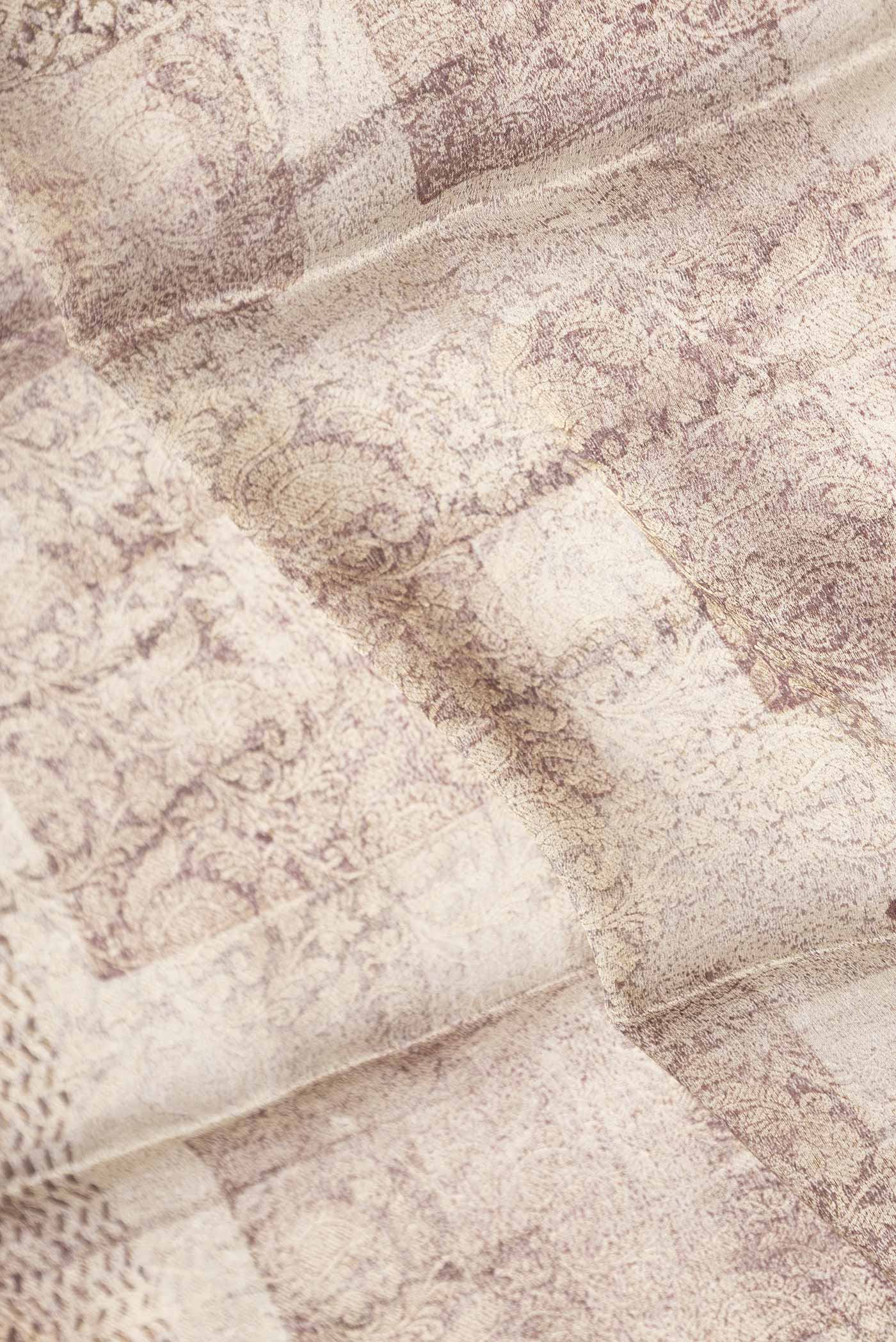 Close up of Beige Dual Tone Mysore Georgette Saree With Printed design on the body and Zari Border displaying folds
