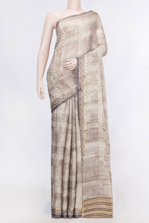 Beige Dual Tone Mysore Georgette Saree With Printed design on the body and Zari Border displayed on a mannequin