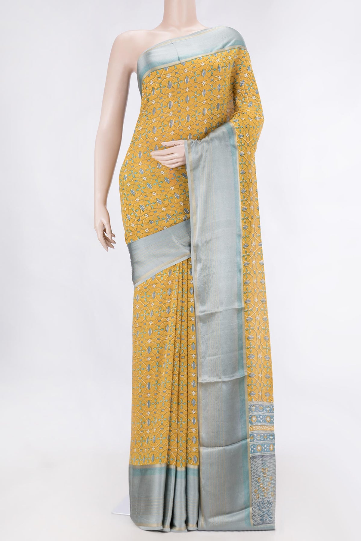 Mustard Dual Tone Mysore Georgette SareePrinted design on the body and Zari Border displayed on a mannequin