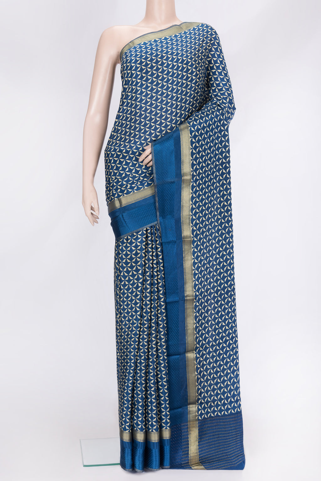 Navy Blue Dual Tone Crepe Saree with Printed design on the body and Zari Border.  displayed on a mannequin
