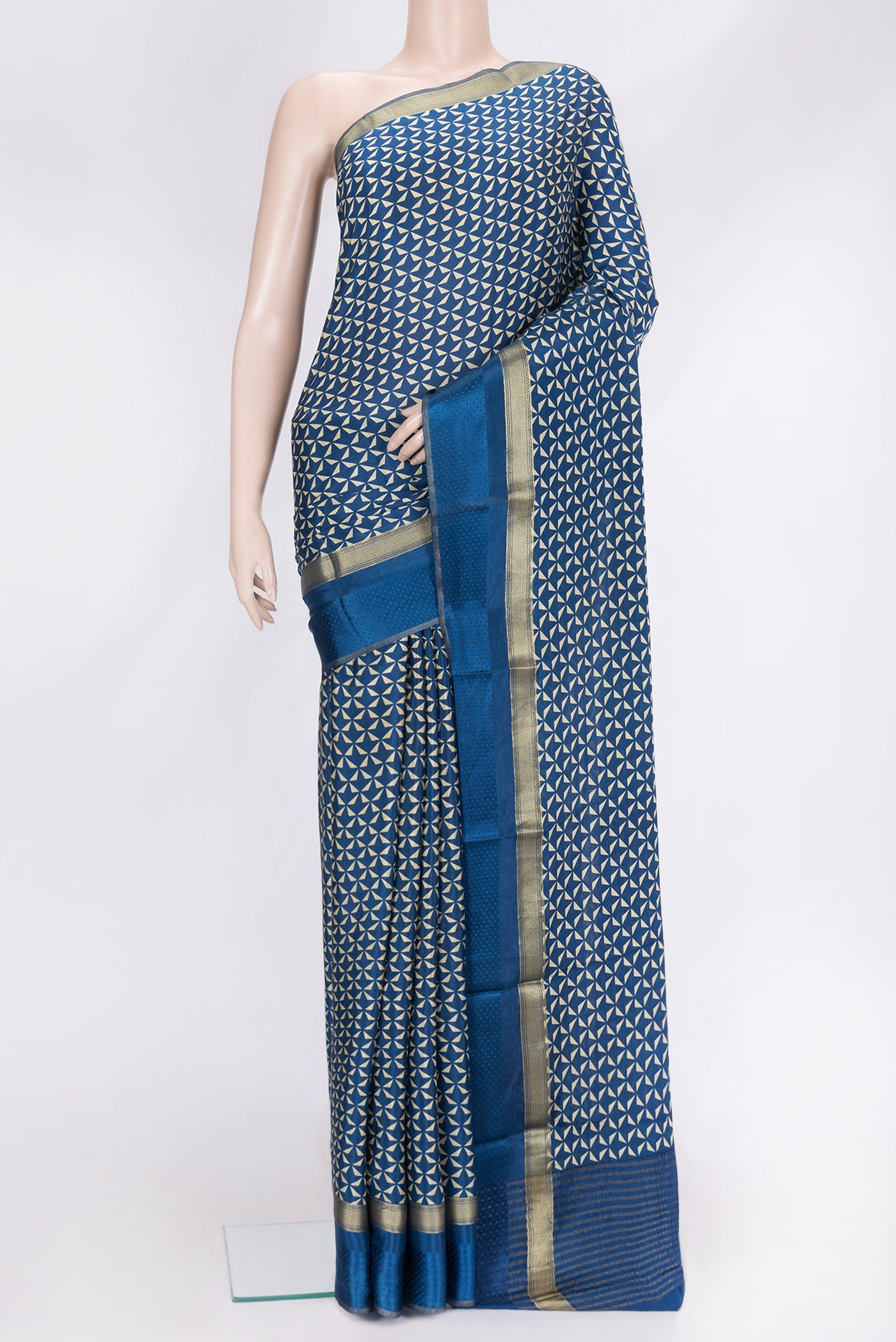 Navy Blue Dual Tone Crepe Saree with Printed design on the body and Zari Border.  displayed on a mannequin