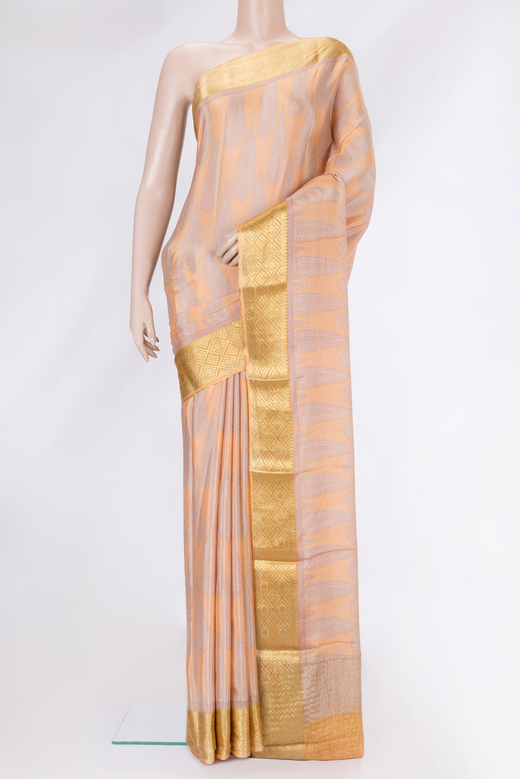 Peach Dual Tone Mysore Crepe Saree with Printed design on the body and Zari Border.  displayed on a mannequin