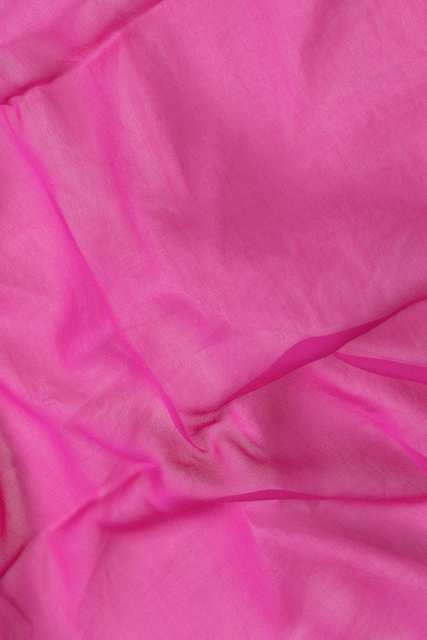 Close up of Pink Dual Tone Mysore Silk Saree with Plain Body and Zari Border.  displaying folds