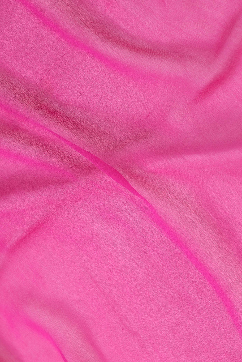 Close up of Pink Dual Tone Mysore Georgette Saree with Plain Body and Zari Border.  displaying folds