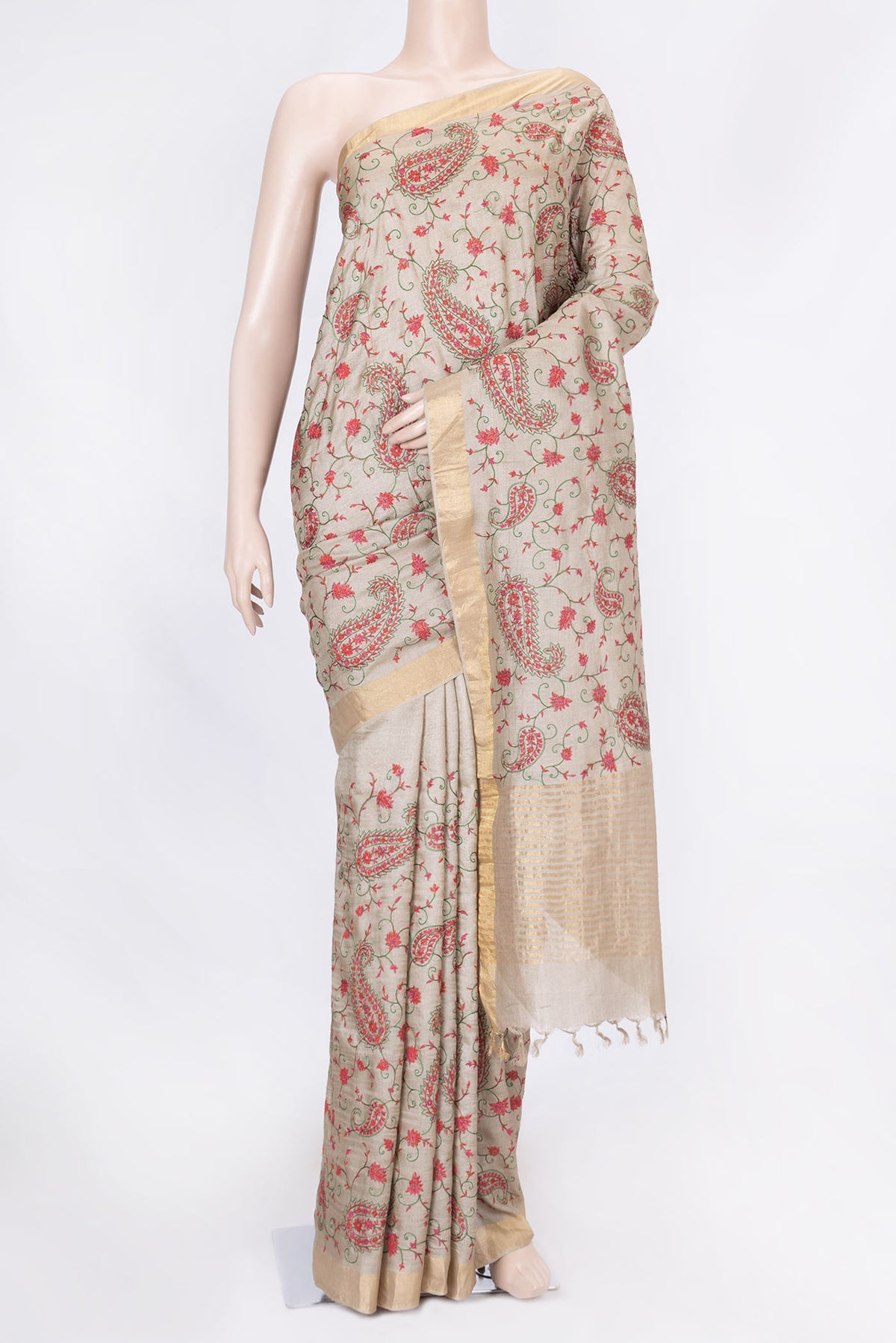 Beige Dual Tone Tussar Saree with Embroidery on the body and Zari Border displayed on a mannequin