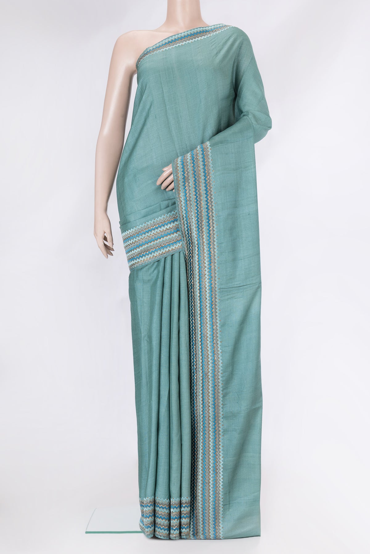 Grey Dual Tone Tussar Silk Saree with Plain Body and Embroidery Border.  displayed on a mannequin