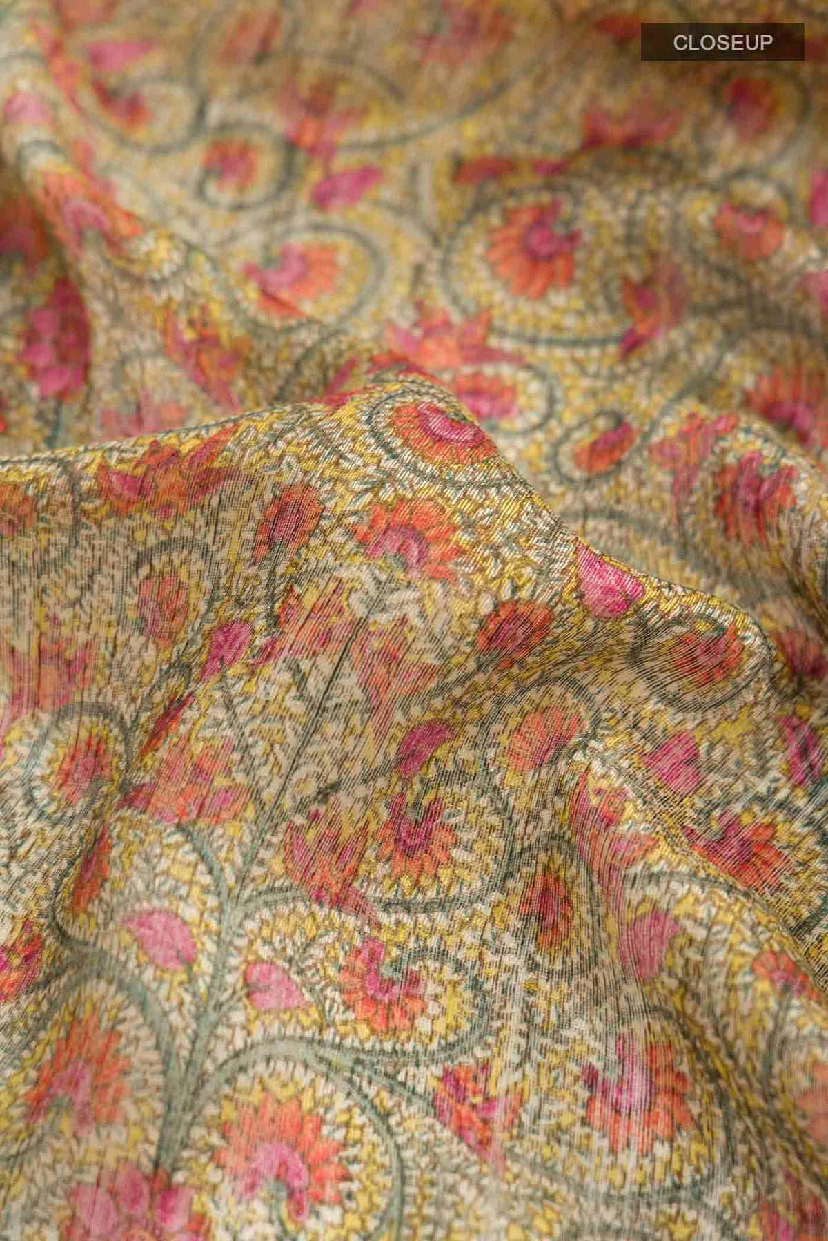 Close up of Yellow Bhagalpuri Tussar Silk Saree with Printed design on the body and Thread Border displaying folds