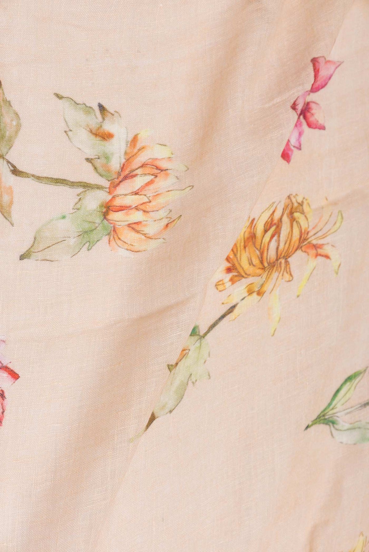 Close up of Peach Dual Tone Linen Saree with Printed design on the body and Zari Border displaying folds