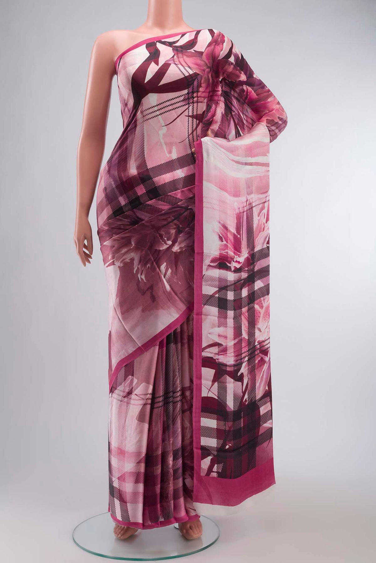 Rose pink Satin Silk Saree with Abstract Print on the body and Plain Border displayed on a mannequin