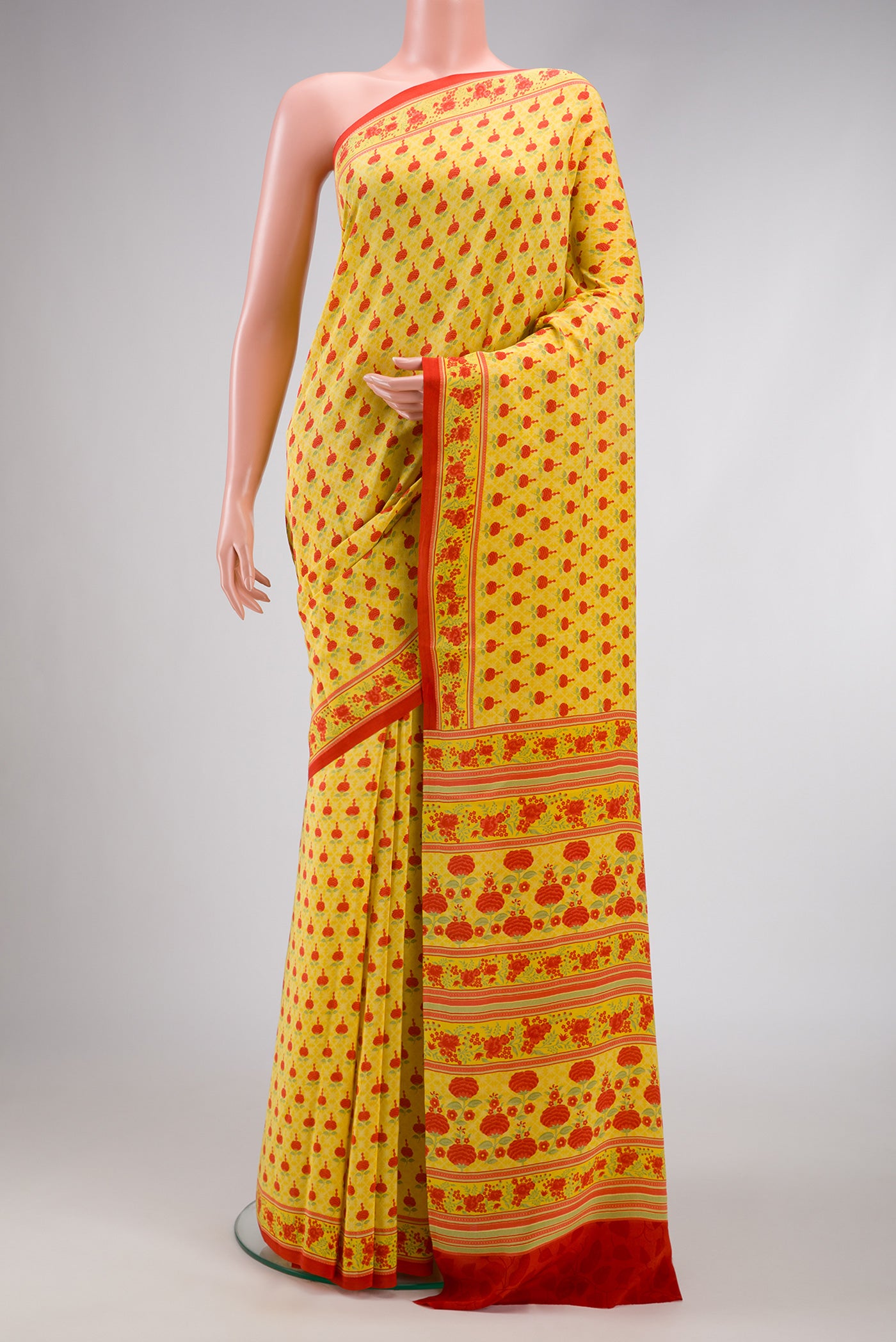Yellow Dual Tone Mysore Crepe Saree with Printed design on the body and Printed Border.  displayed on a mannequin