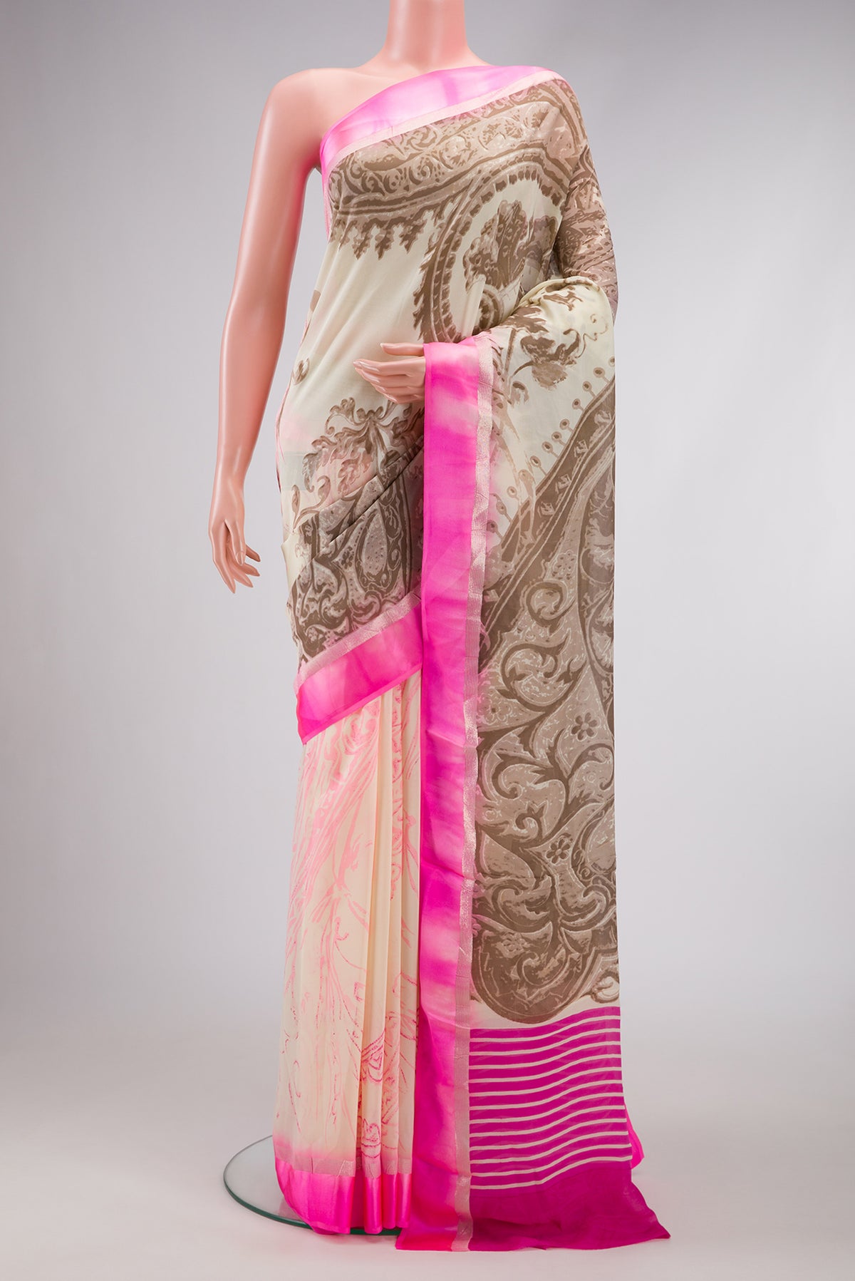 Sandal Dual Tone Mysore Crepe Saree with Printed design on the body and Zari Border.  displayed on a mannequin