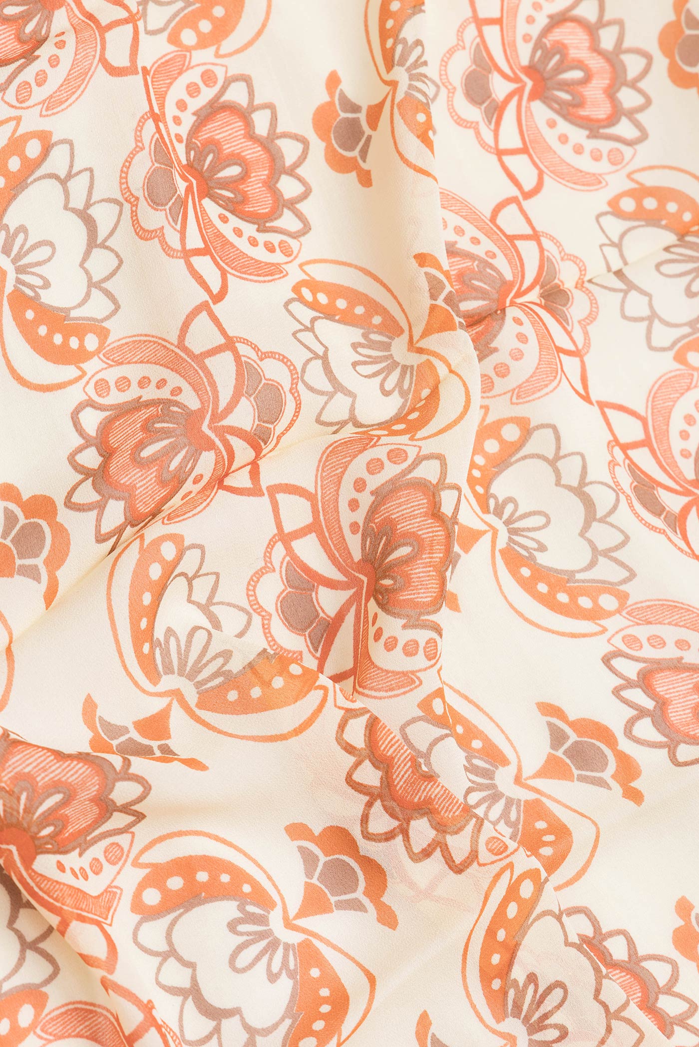 Close up of Beige Dual Tone Mysore Georgette Saree with Printed design on the body and Zari Border.  displaying folds