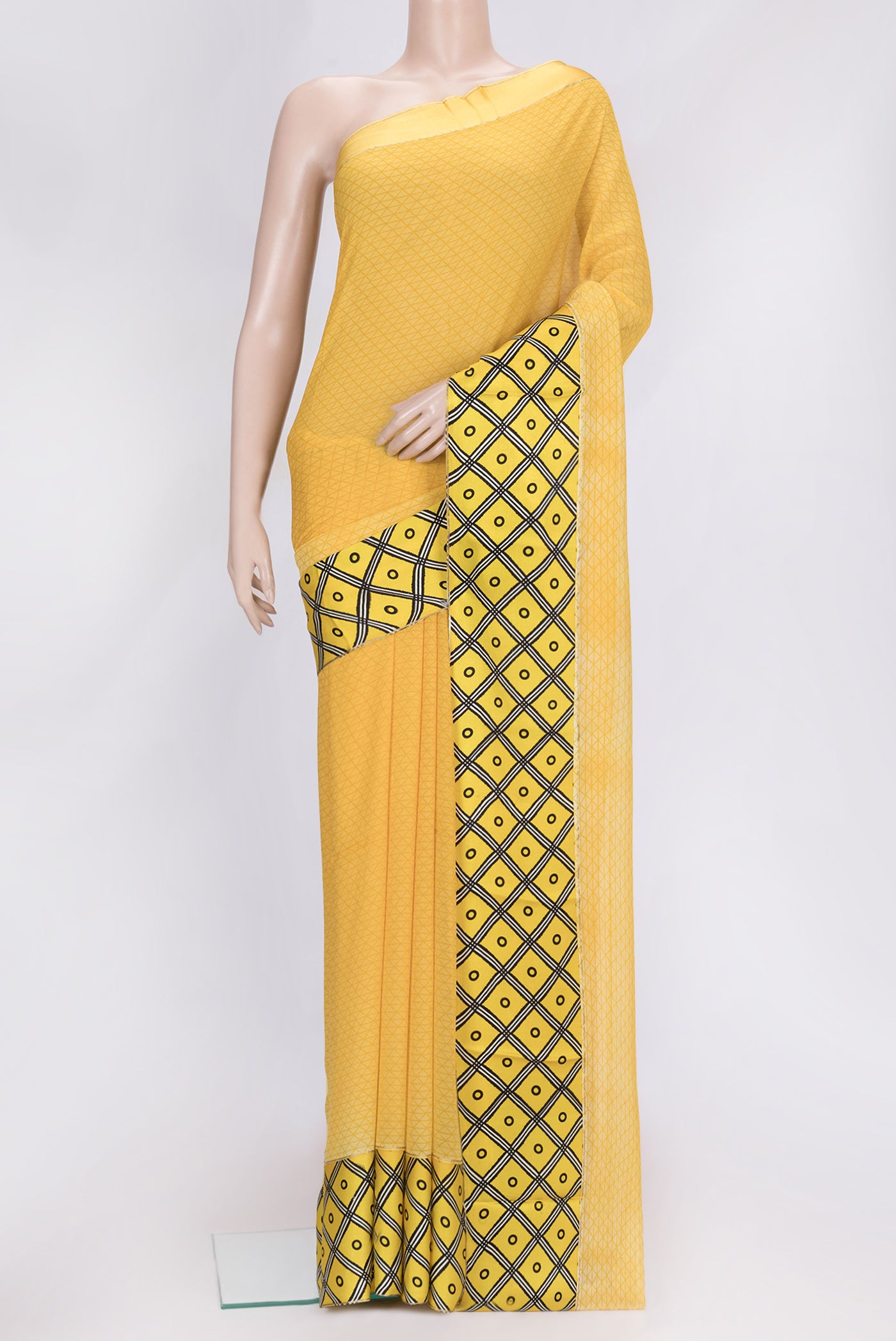 Mustard Dual Tone Mysore Chiffon Saree with Printed design on the body and Fancy Border.  displayed on a mannequin