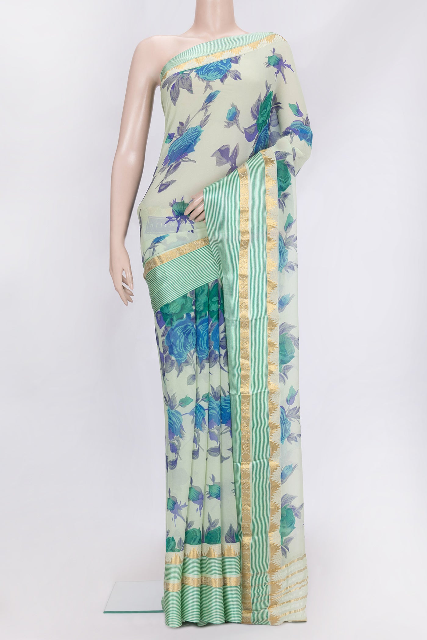 Pista Green Dual Tone Mysore Chiffon Saree with Printed design on the body and Zari Border.  displayed on a mannequin