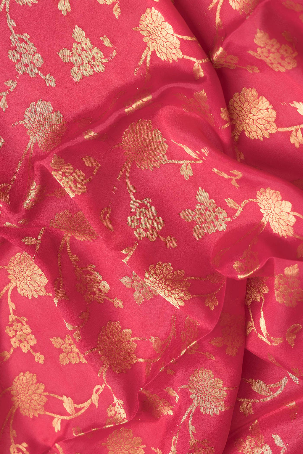 Close up of Pink Dual Tone Georgette Saree with Zari Brocade on the body and Zari Border.  displaying folds