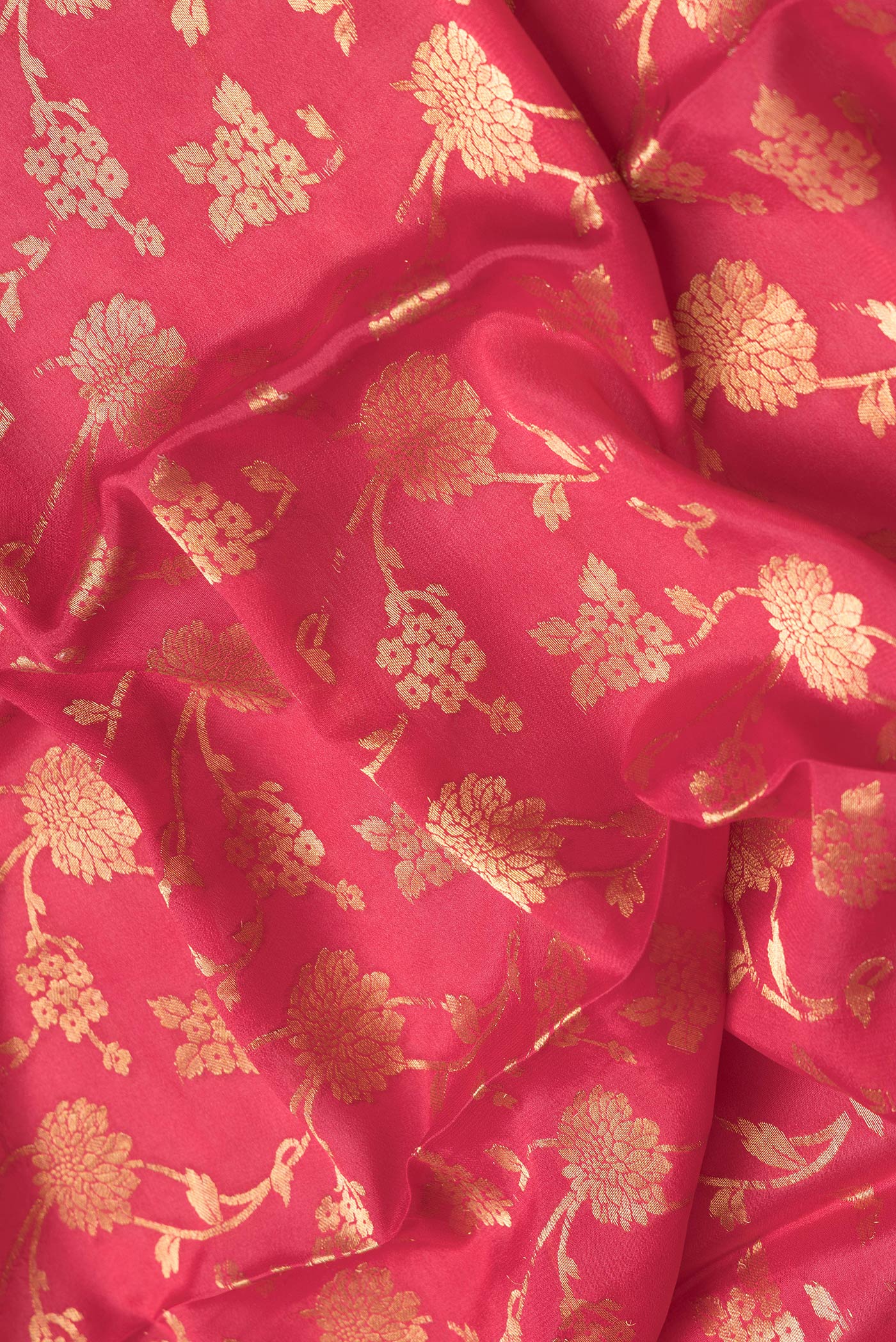 Close up of Pink Dual Tone Georgette Saree with Zari Brocade on the body and Zari Border.  displaying folds