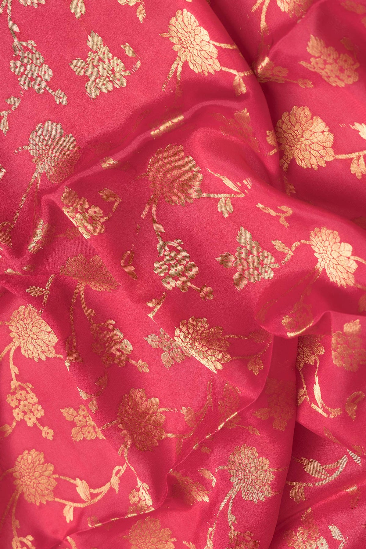 Close up of Pink Dual Tone Georgette Saree with Zari Brocade on the body and Zari Border.  displaying folds
