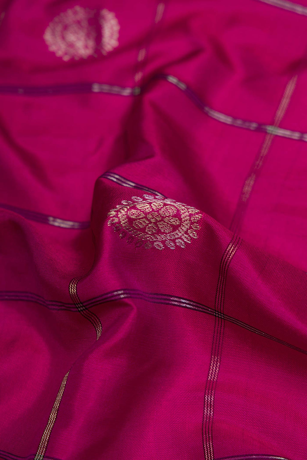 Close up of Pink Dual Tone Gadwal Silk Saree with Checked design on the body and Zari Border displaying folds