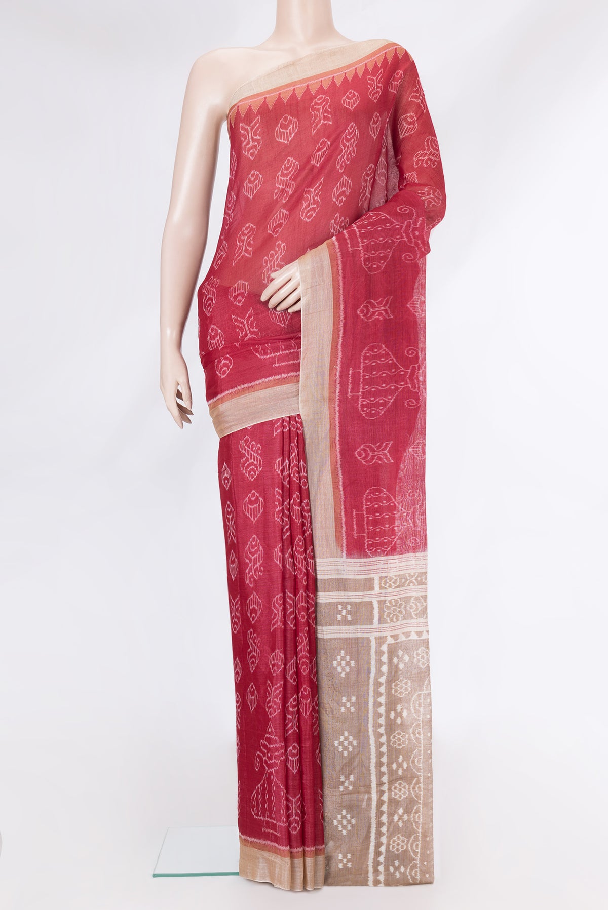 Deep Red Dual Tone Tussar Silk Saree with Printed design on the body and Ikat Border.  displayed on a mannequin