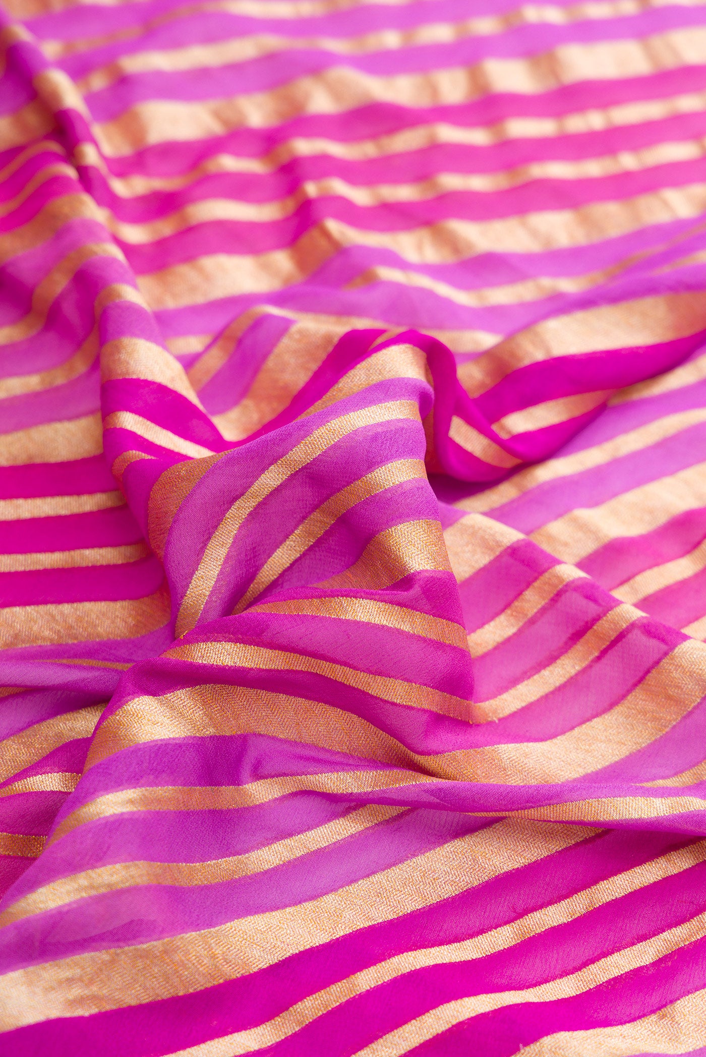 Close up of Lavender Dual Tone Mysore Georgette Saree with Stripes on the body and Zari Border.  displaying folds