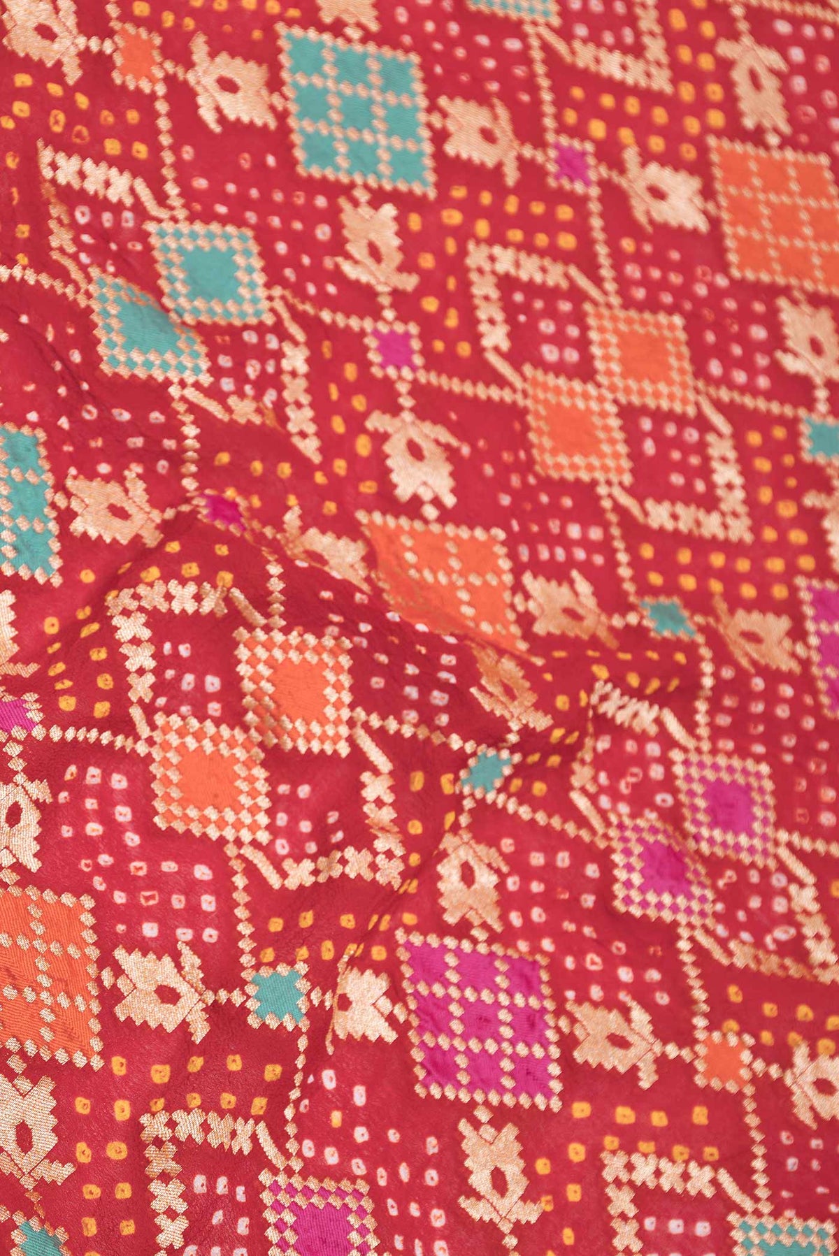 Close up of Red Dual Tone Banarasi Georgette Saree with Zari Brocade on the body and Zari Border displaying folds