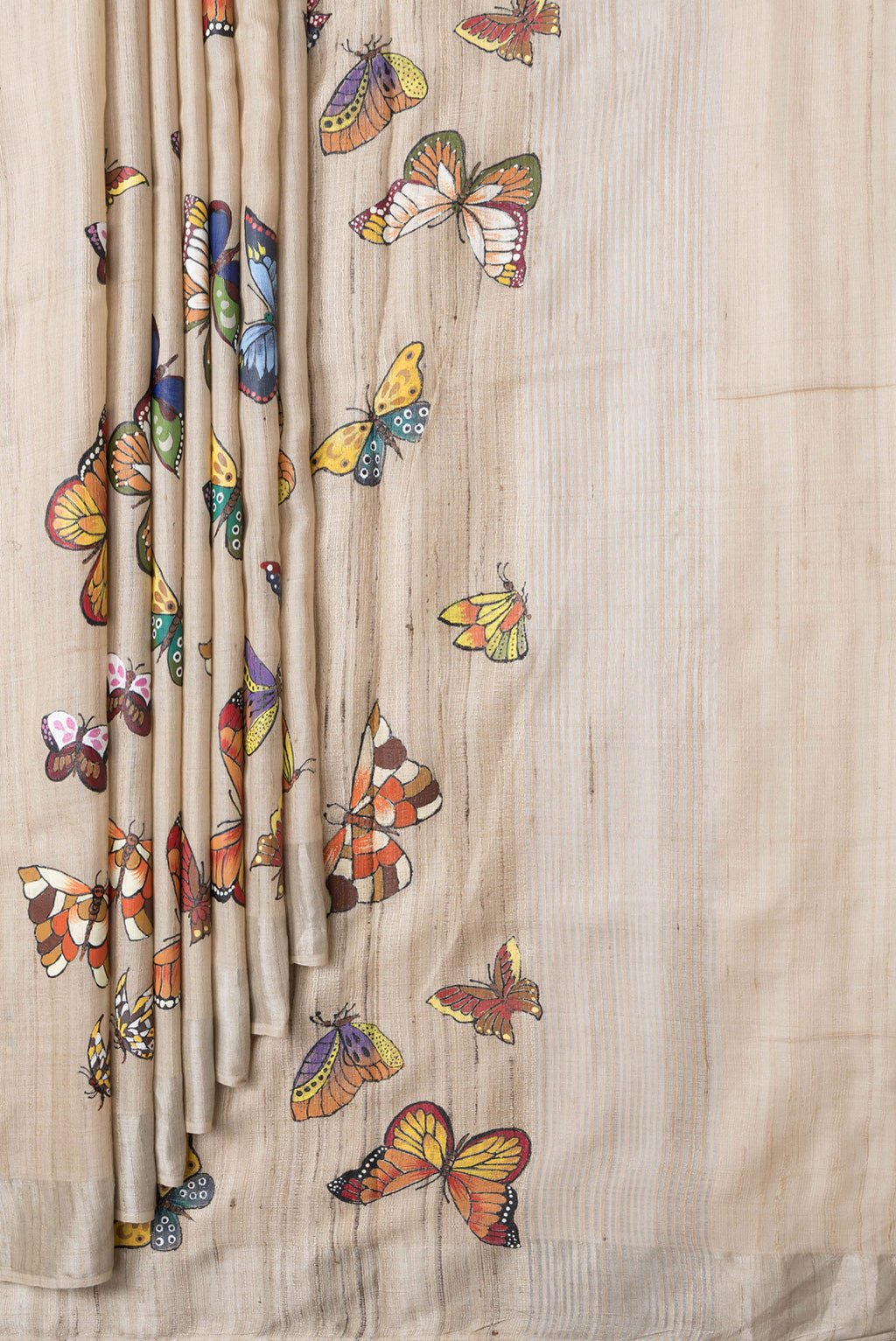 Pleats and pallu of Beige Dual Tone Tussar Silk Saree with Printed design on the body and Zari Border. 