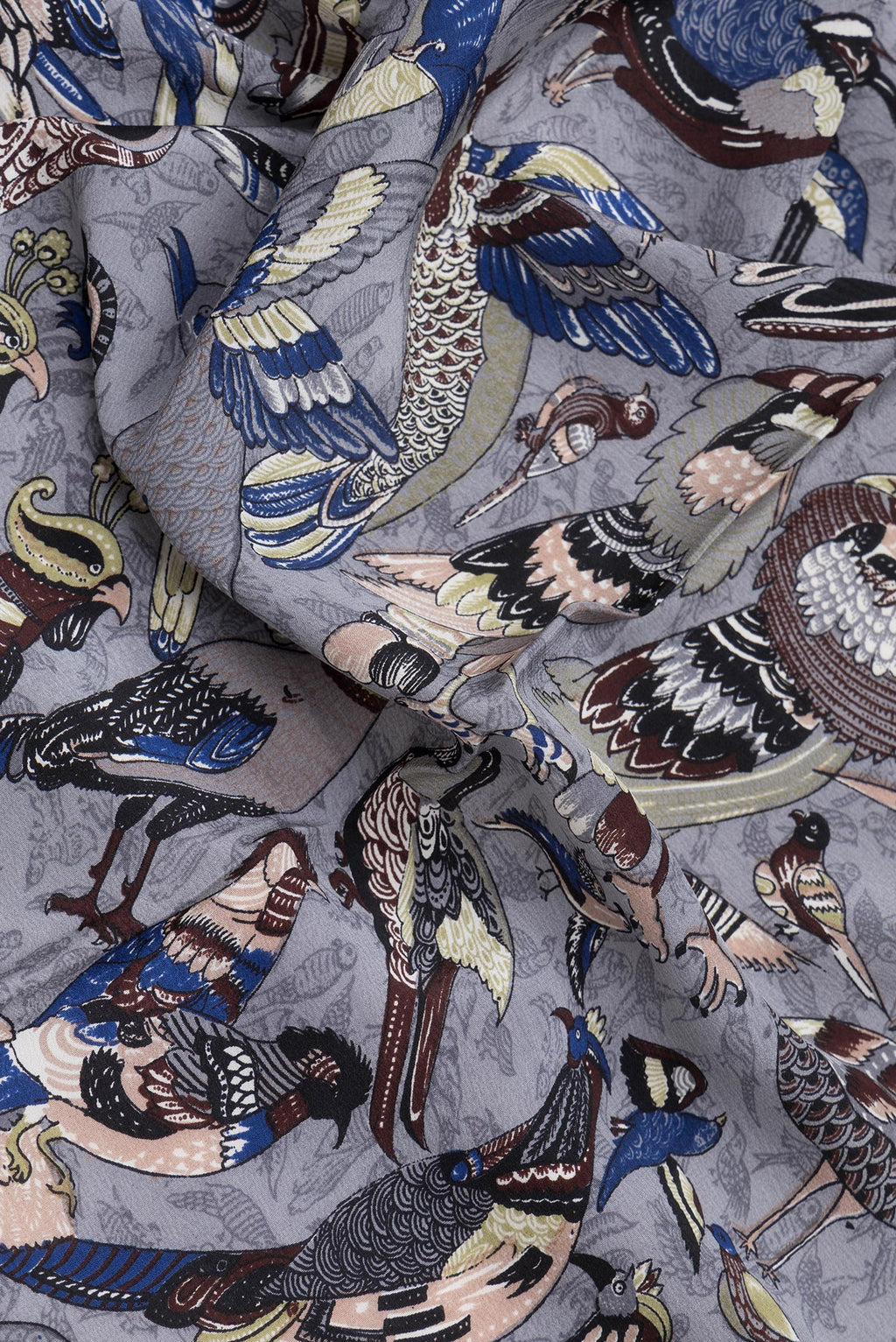 Close up of Grey Dual Tone Mysore Crepe Saree with Printed design on the body and Without Border.  displaying folds
