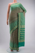 Grey Banarasi Georgette Saree with Bandhani Print on the body and Zari Border displayed on a mannequin