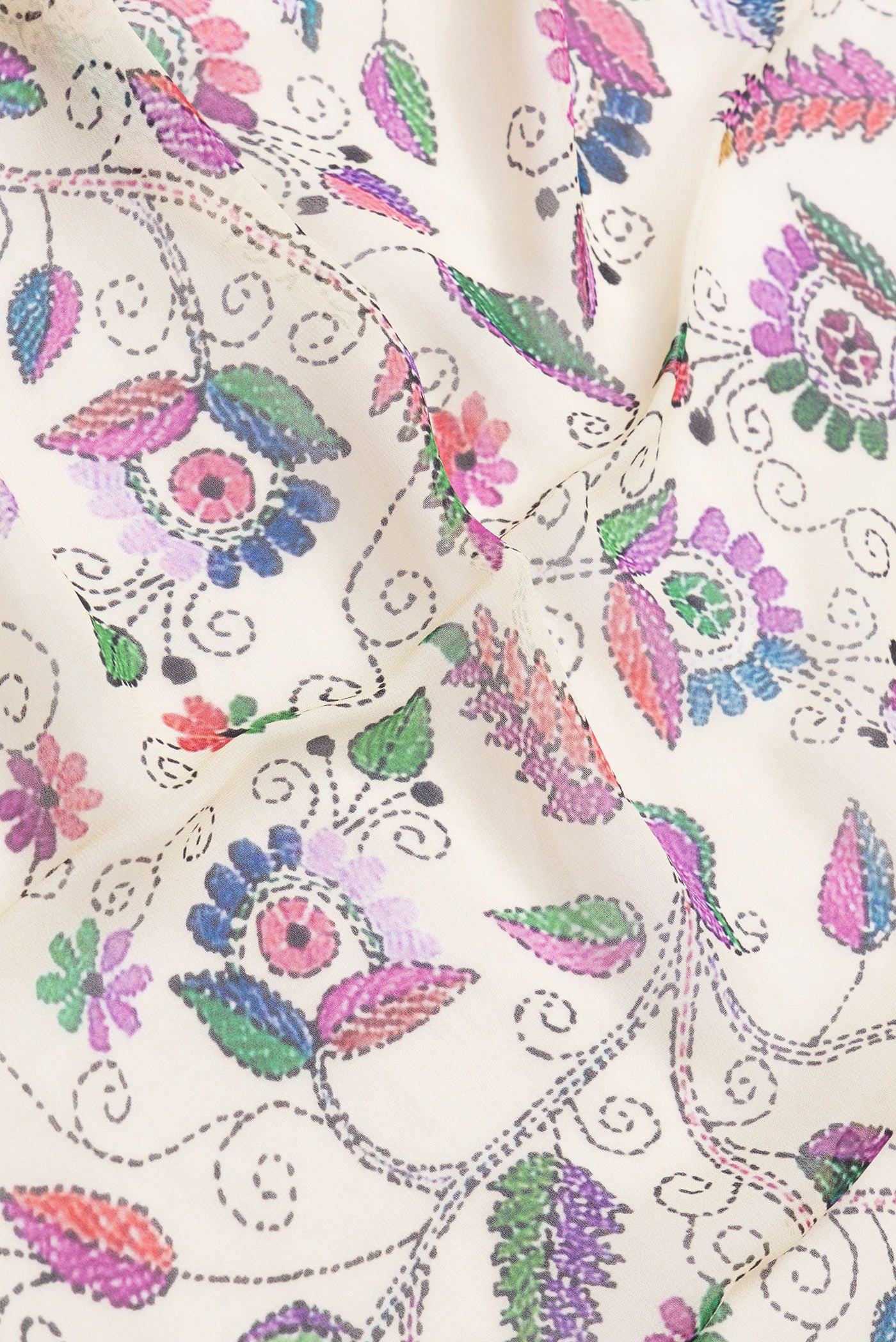 Close up of Beige Dual Tone Mysore Georgette Saree with Printed design on the body and Printed Border.  displaying folds